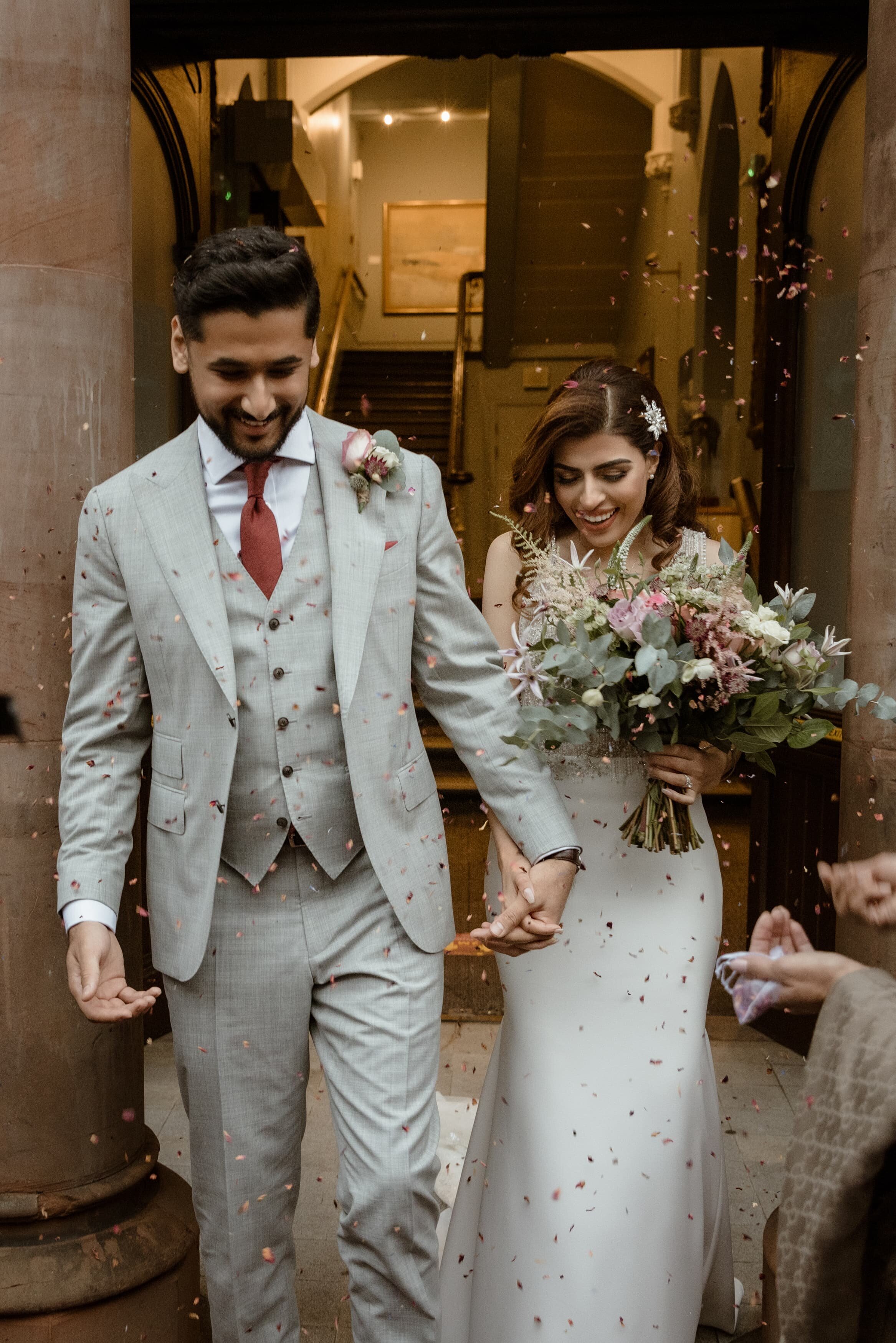 couple-posin-for-London-elopement-photographer-after-wedding-arriving-at-wedding-venue-3647-2-Hadi Photography