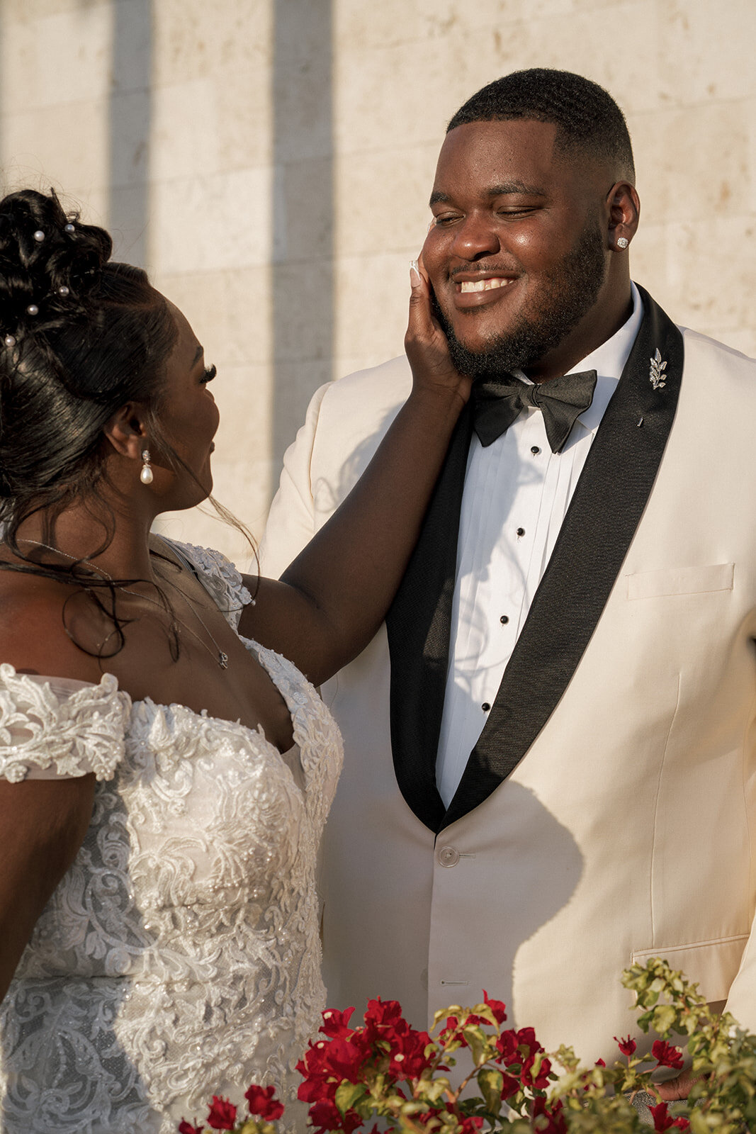 bride touching groom face wedding