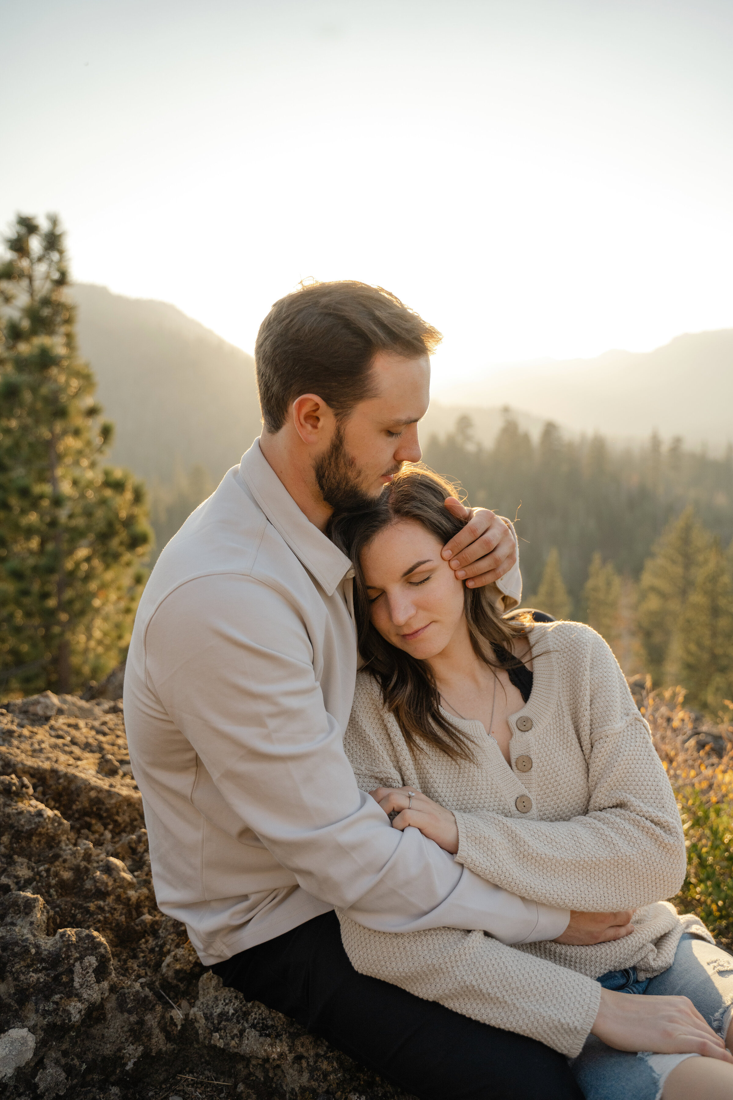 Couple cuddling in the mountains