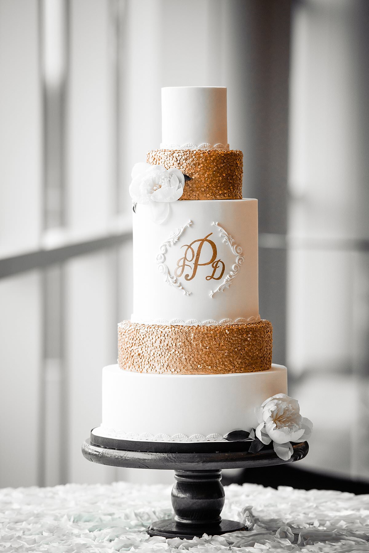 5 Tier White and GOld Wedding Cake with hand painted monogram and gold textured layers with white flowers