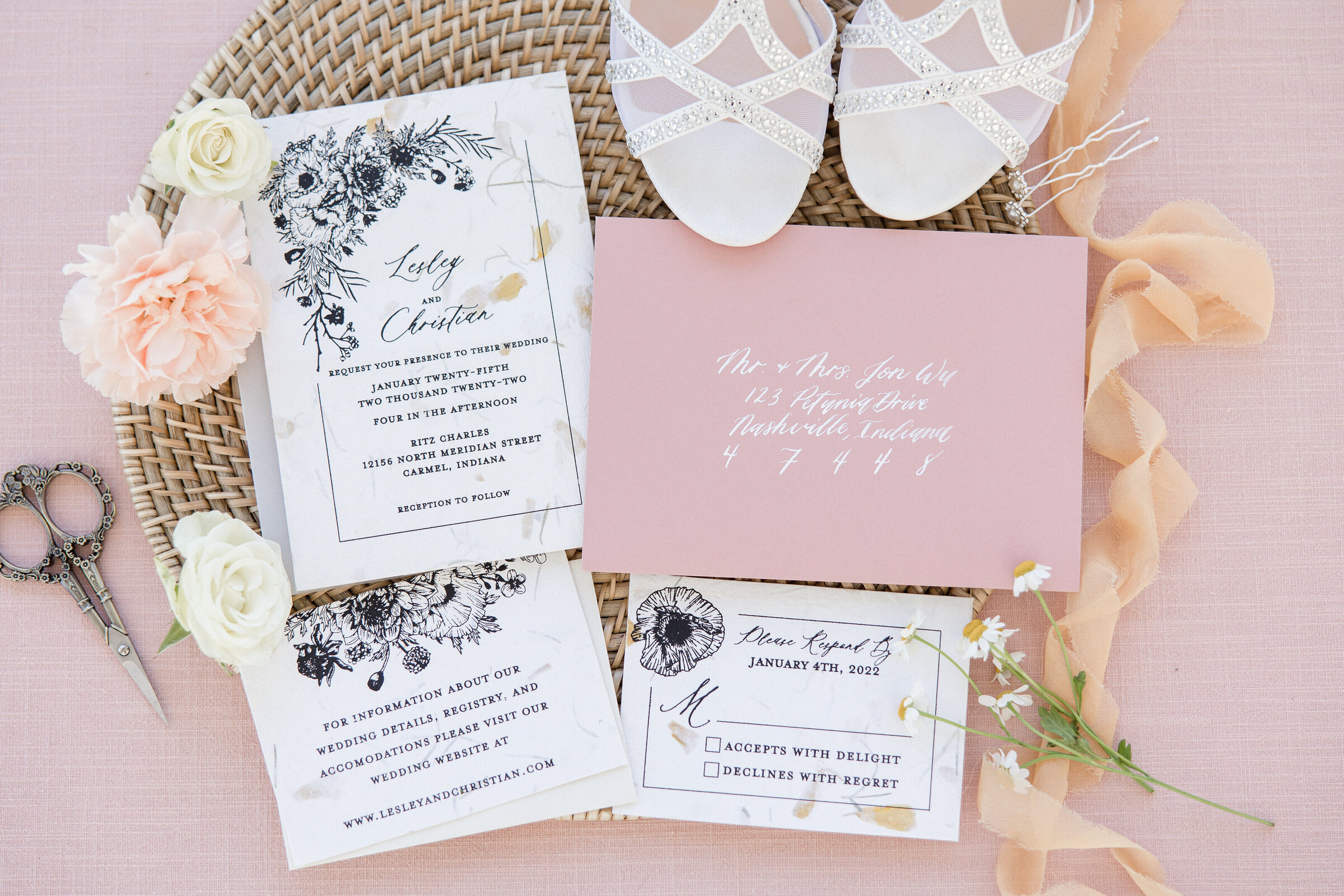 pink invitation suite flat lay