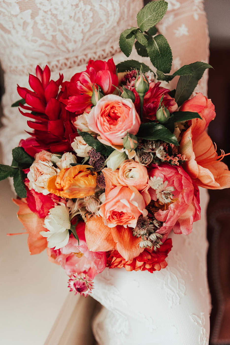 Bright pink and orange tropical bouquet designed by a san diego wedding florist