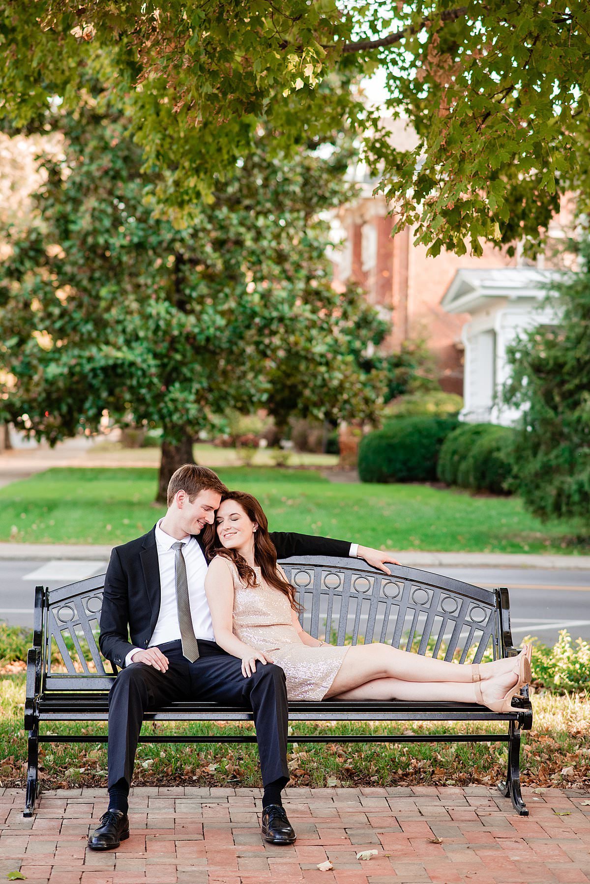 Couple Sitting together on a bench in historic downtown Franklin Tennessee