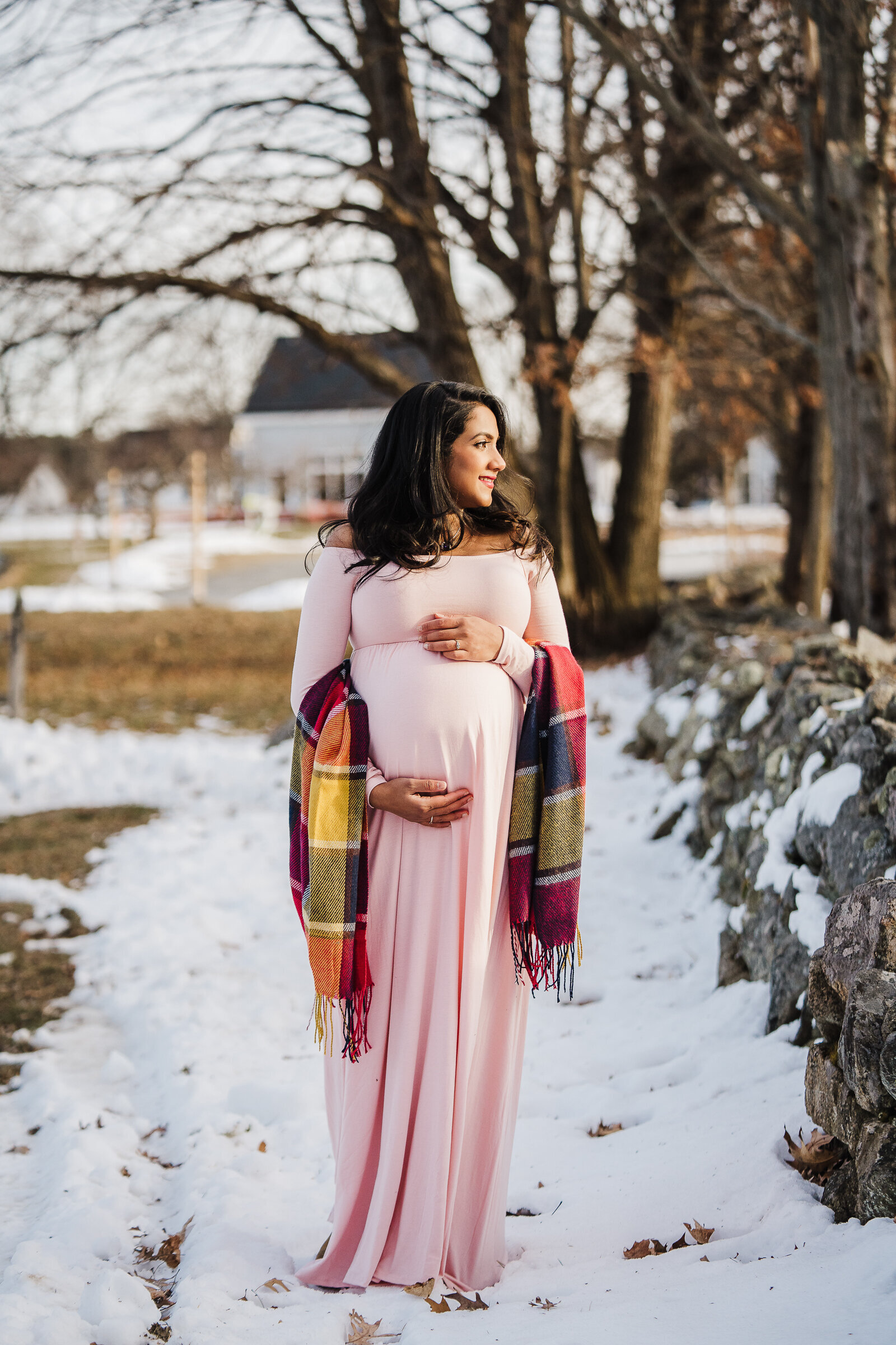 maternity photo with pink dress in snow