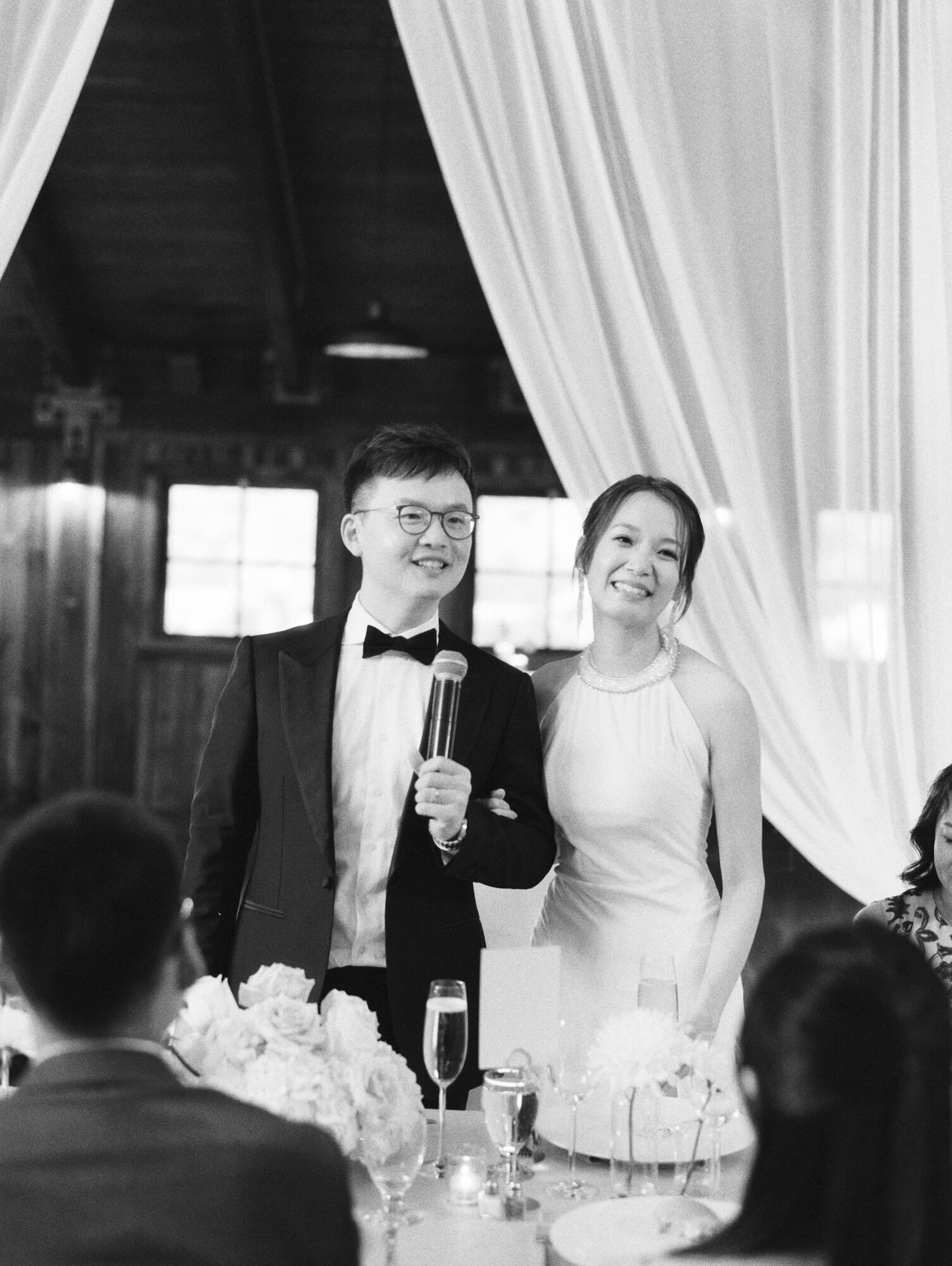 bride and groom giving a toast