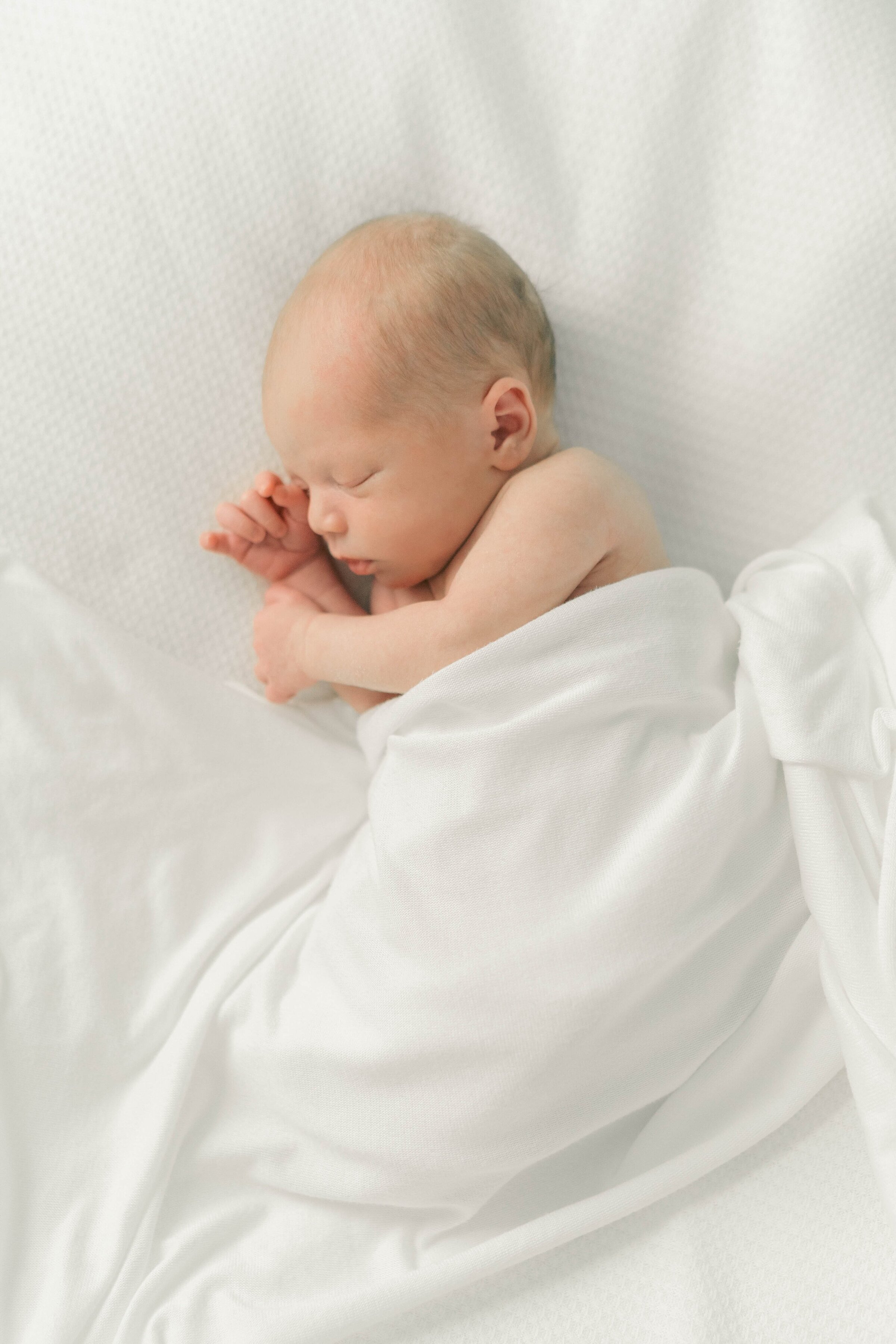 at home newborn photography in cozy home in Holladay, Utah, captured by Utah newborn photographer Iris Graciela Photography