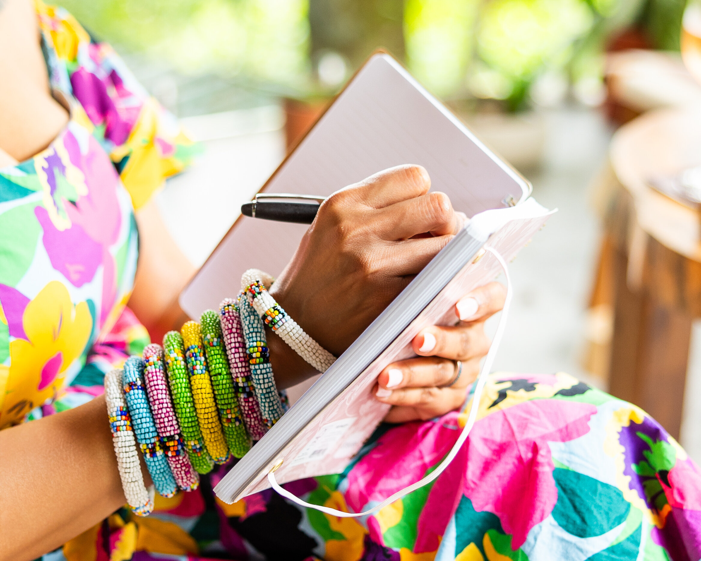 woman writing in a journal close up