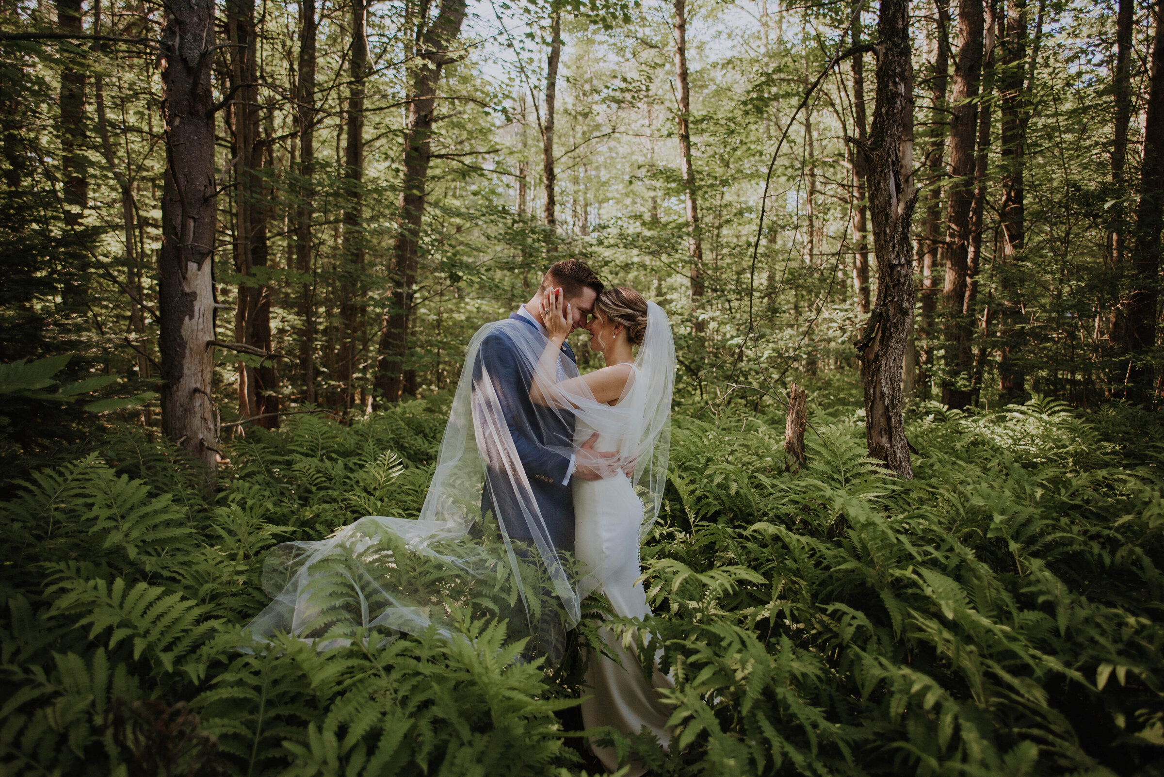 bride and groom posed in Virginia forest