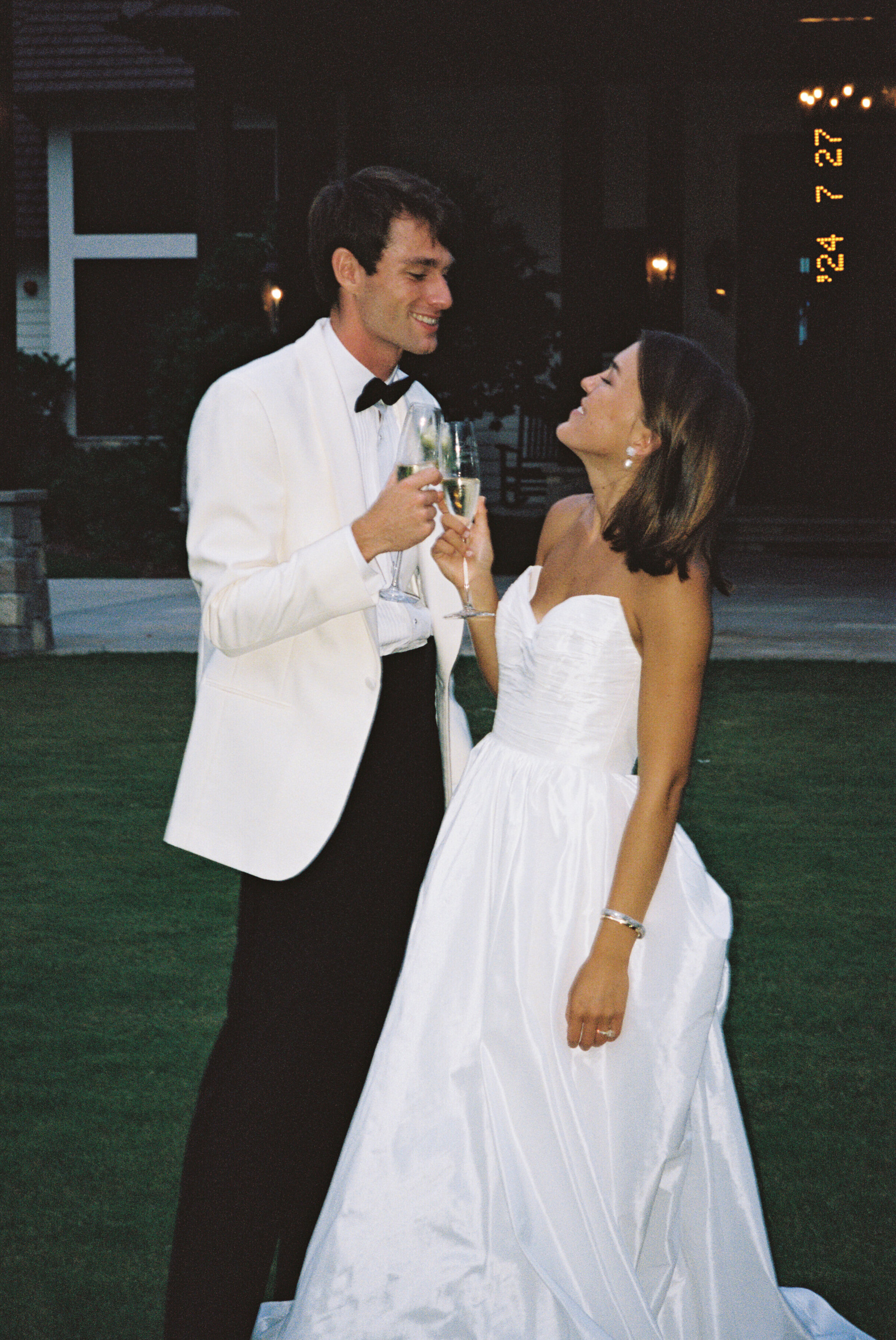 a bride in groom cheersing after their ceremony in St. Simons Island, GA