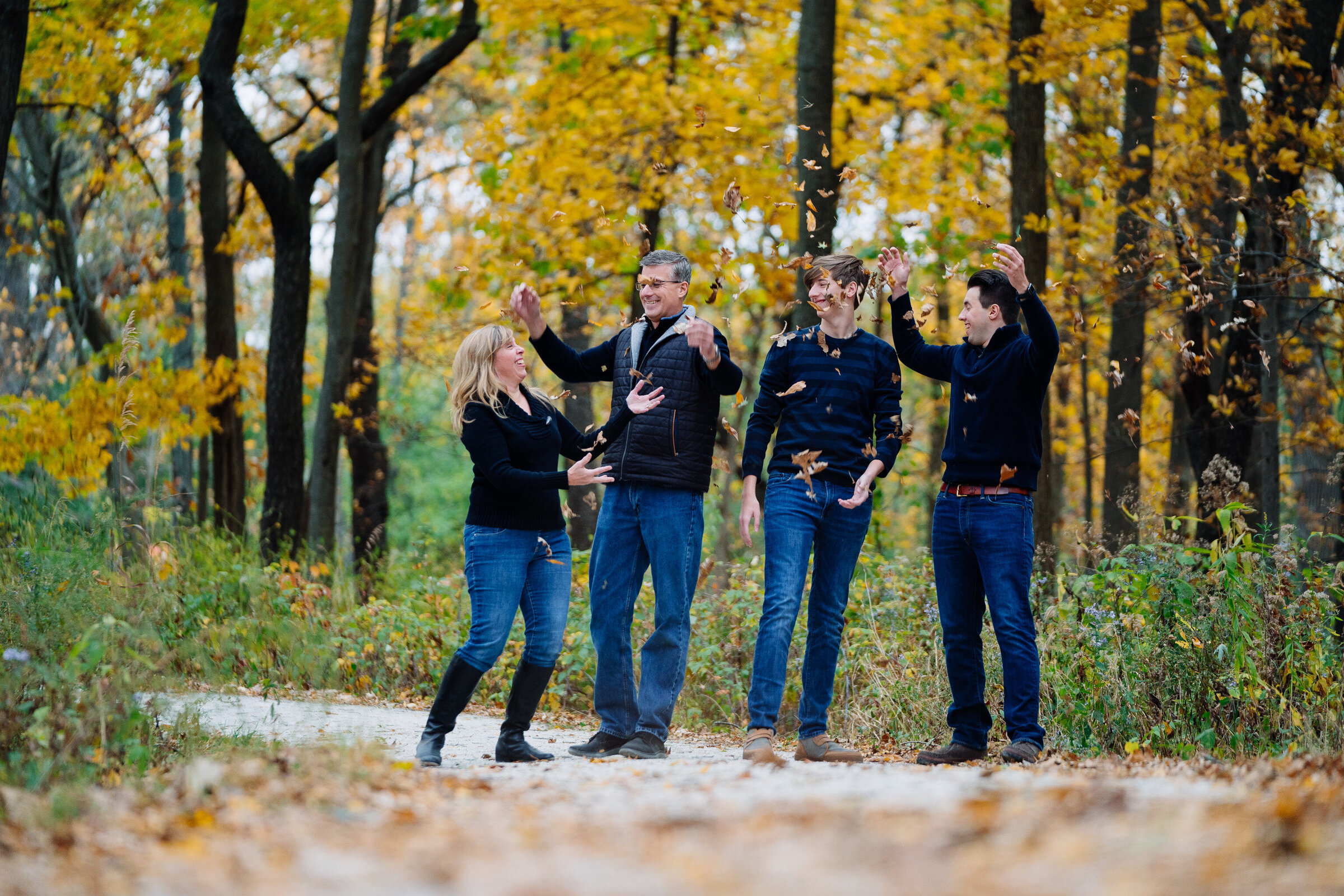 Family throwing leaves