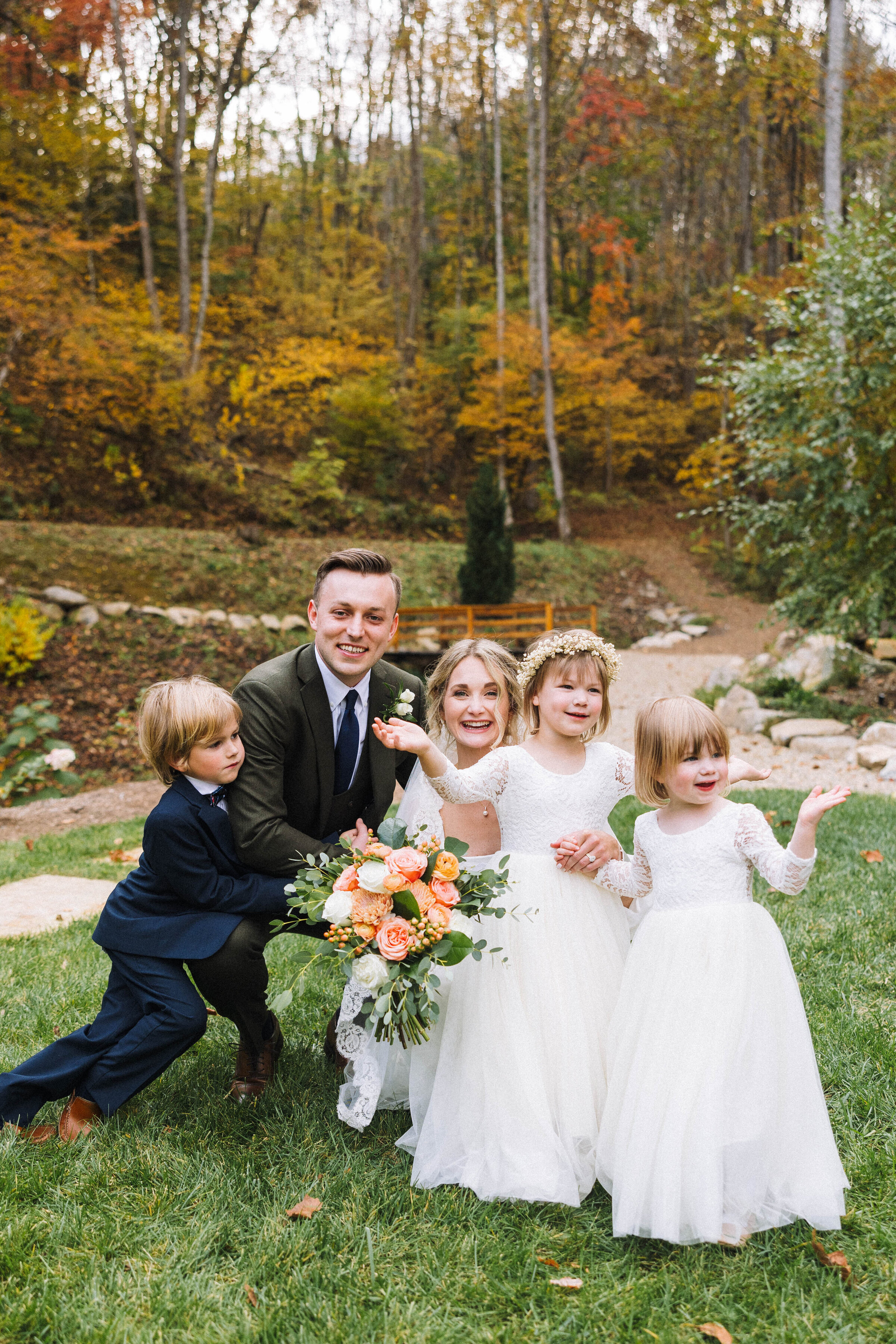 bride and groom with their flower girls