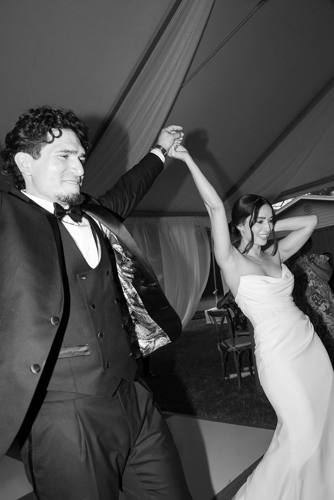 A bride and groom announced for the first time on the dance floor.