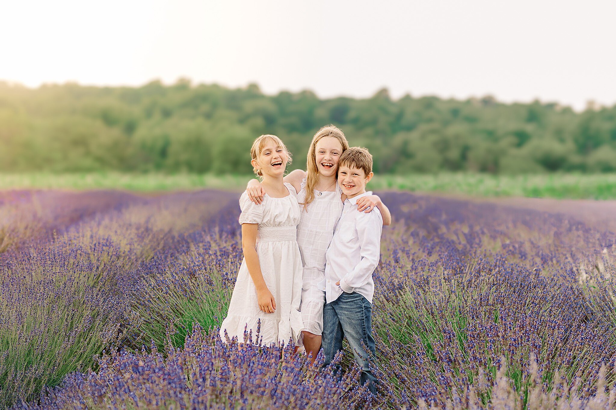 siblings standing together during a summer mini session in the lavender fields of Lancaster, PA