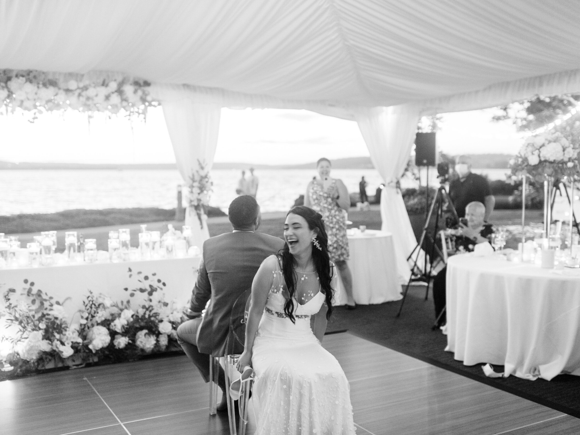 bride and groom playing the shoe game at reception