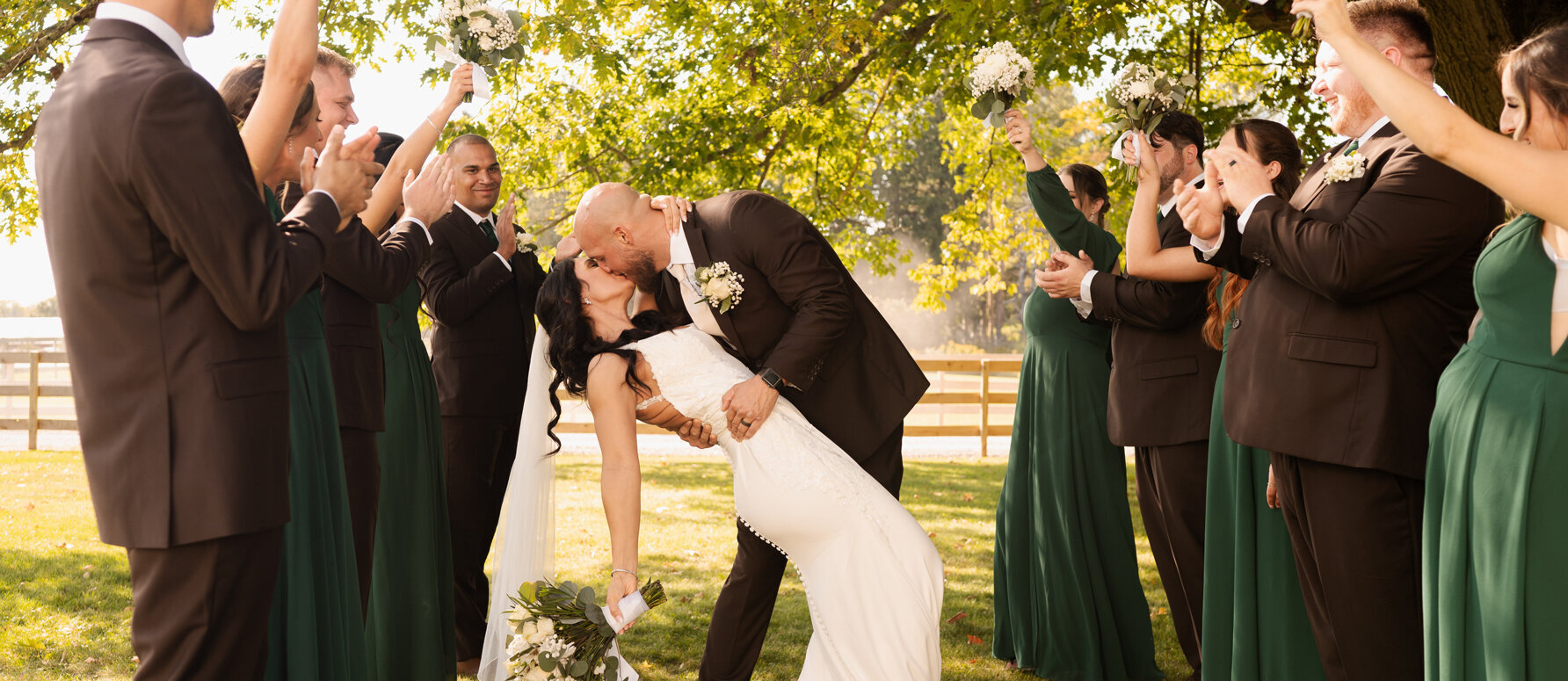 A newly married couple sharing a kiss at Knotting Hill Farm in Jordanville, New York.