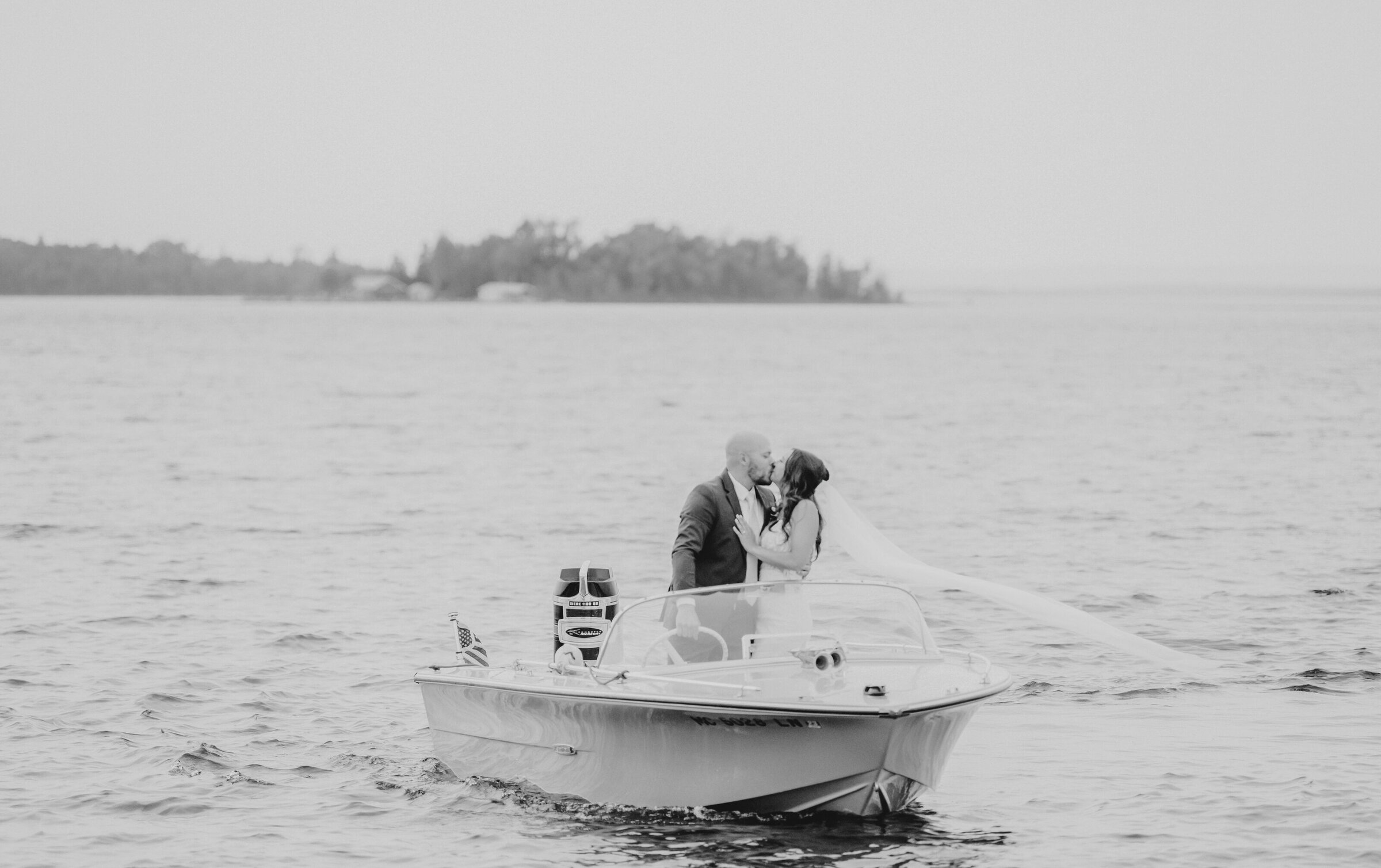 Newly weds in a boat for their wedding on Drummond Island