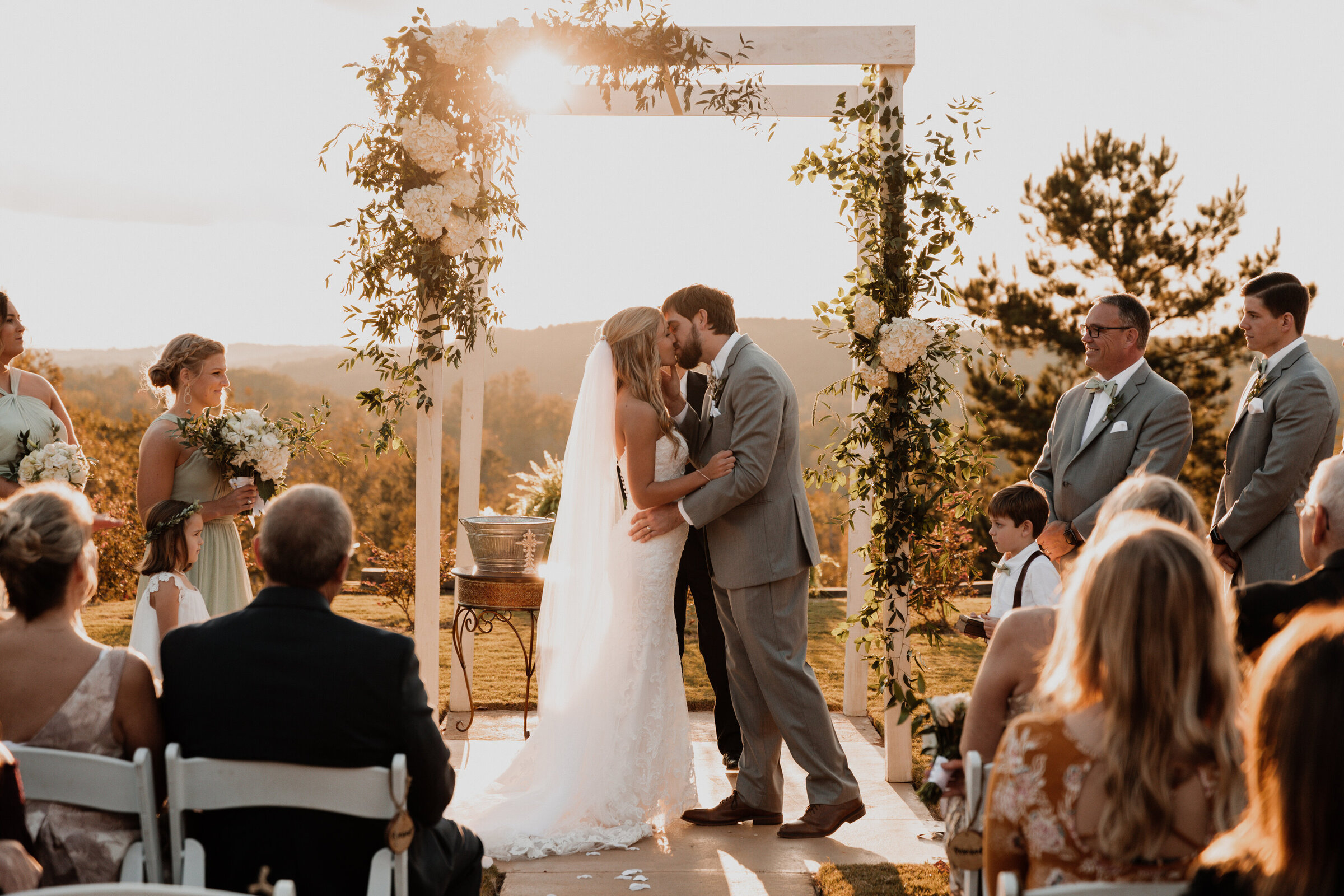 bride & grooms first kiss on their wedding day in the blue ridge mountains