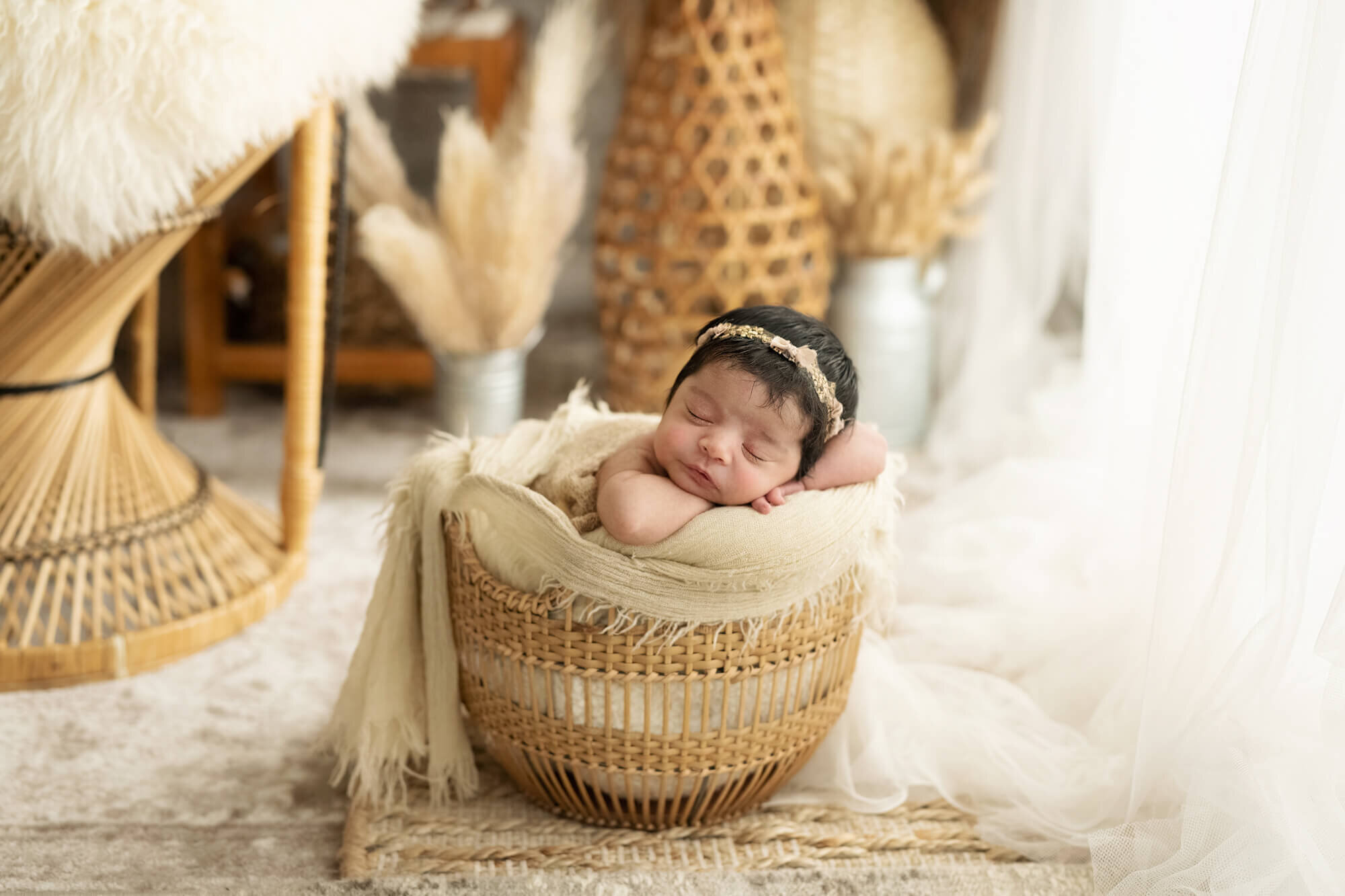 asleep baby girl  in window light with boho setting