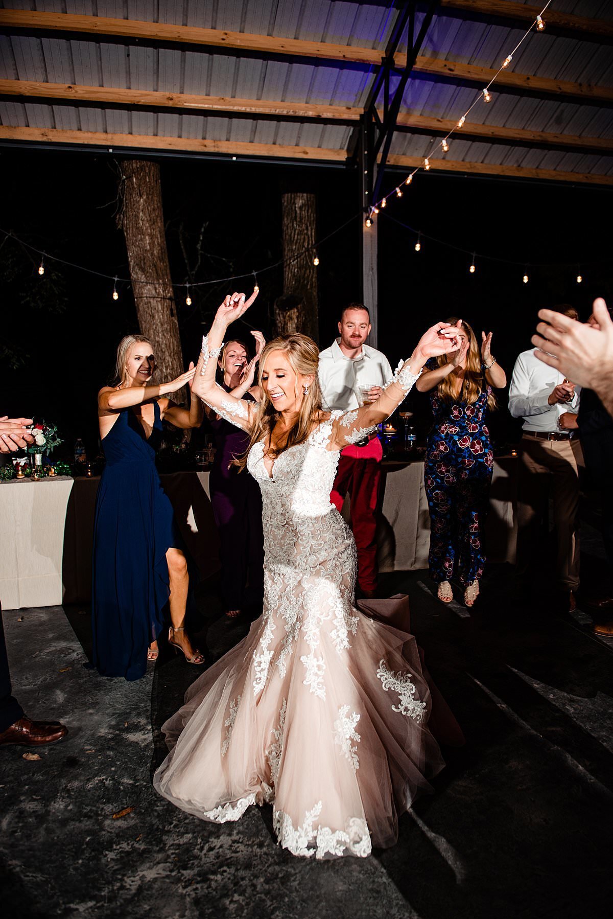 Bride dancing in the middle of her guests during reception