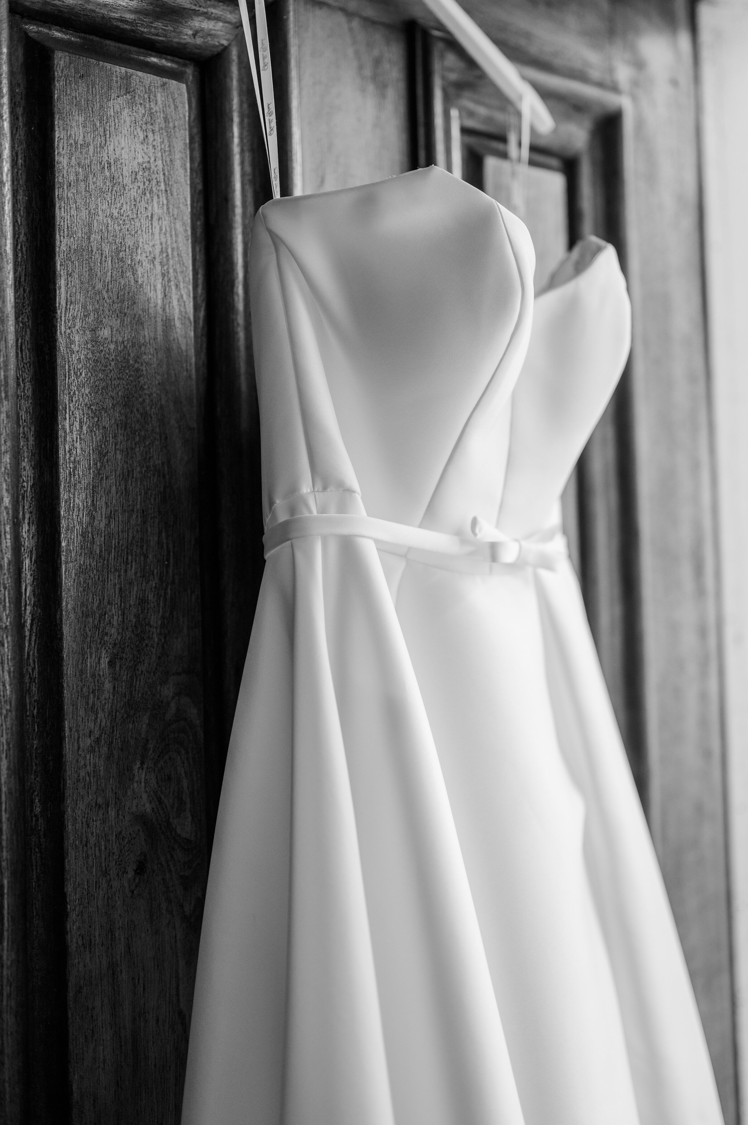 Stella York Wedding gown hanging on the front door at Ashford Acres Inn