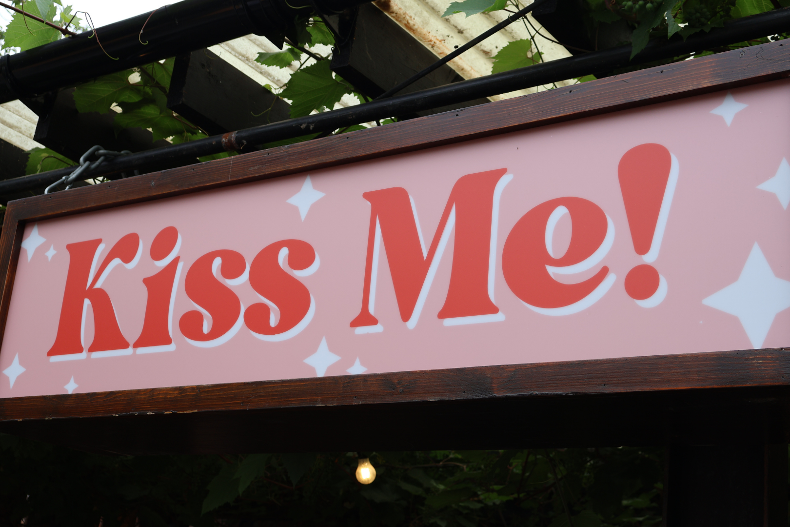 Kiss me sign close up daytime