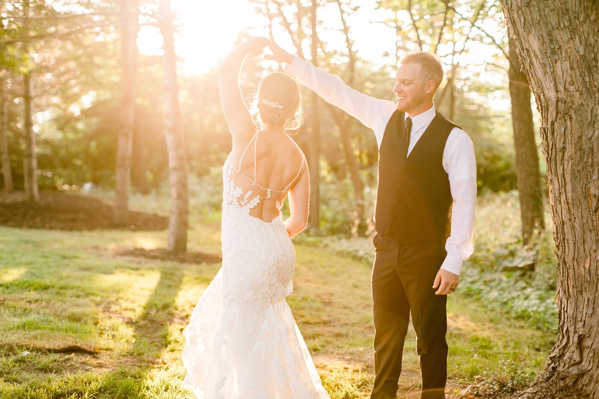Bride and groom dancing in a park, taken by minneapolis wedding photographers
