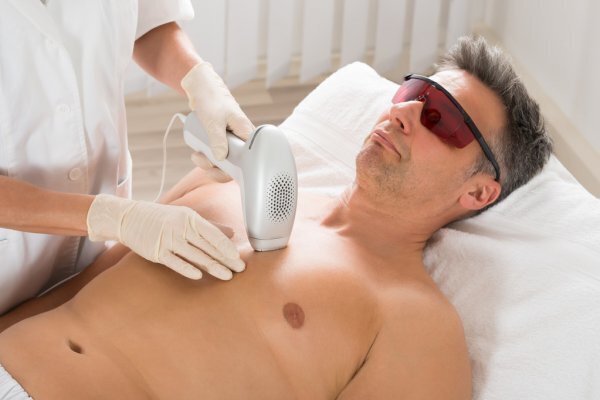 depositphotos_112279908-stock-photo-man-receiving-laser-hair-removal