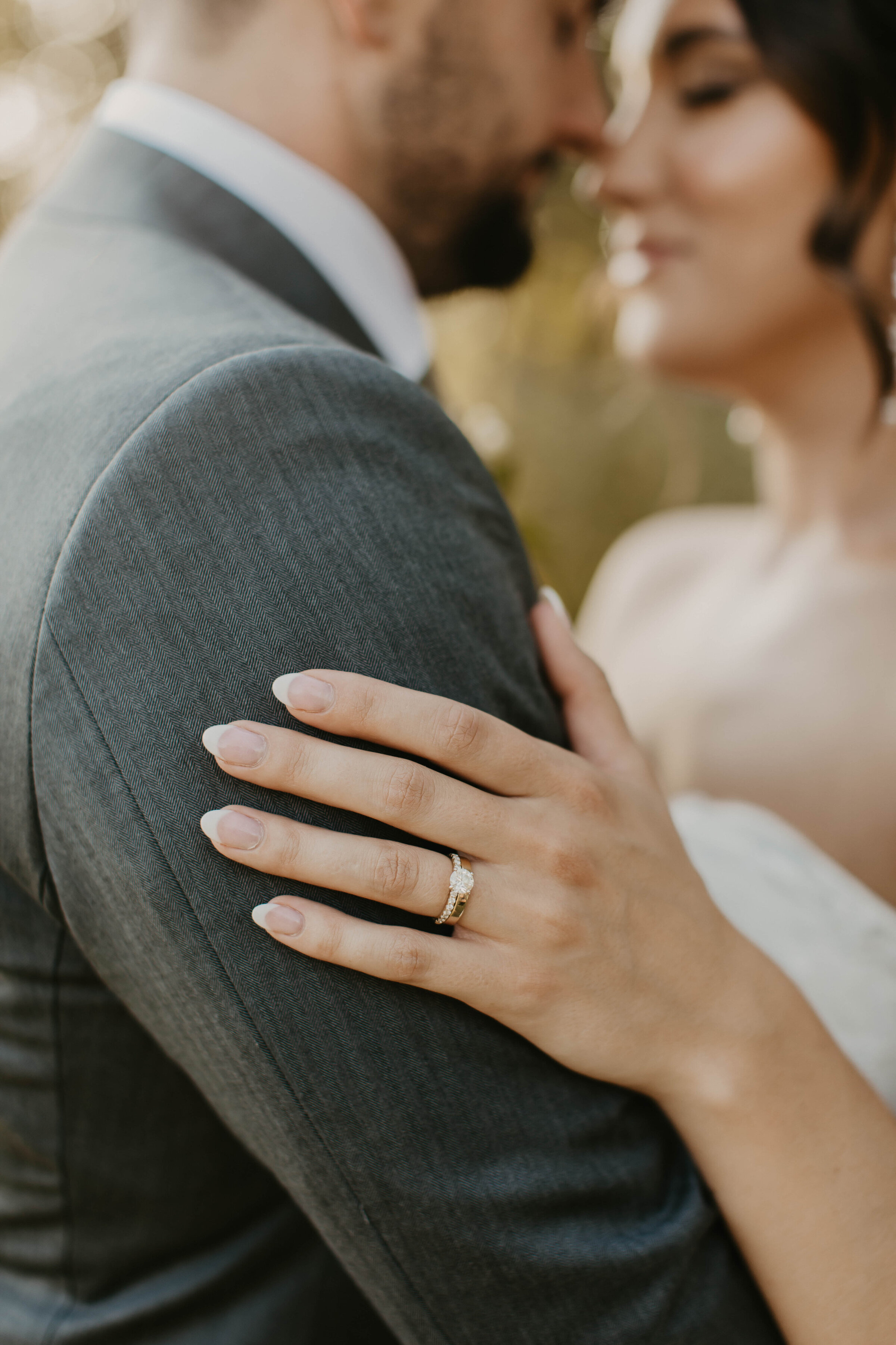Bride and groom sharing intimate moment. 