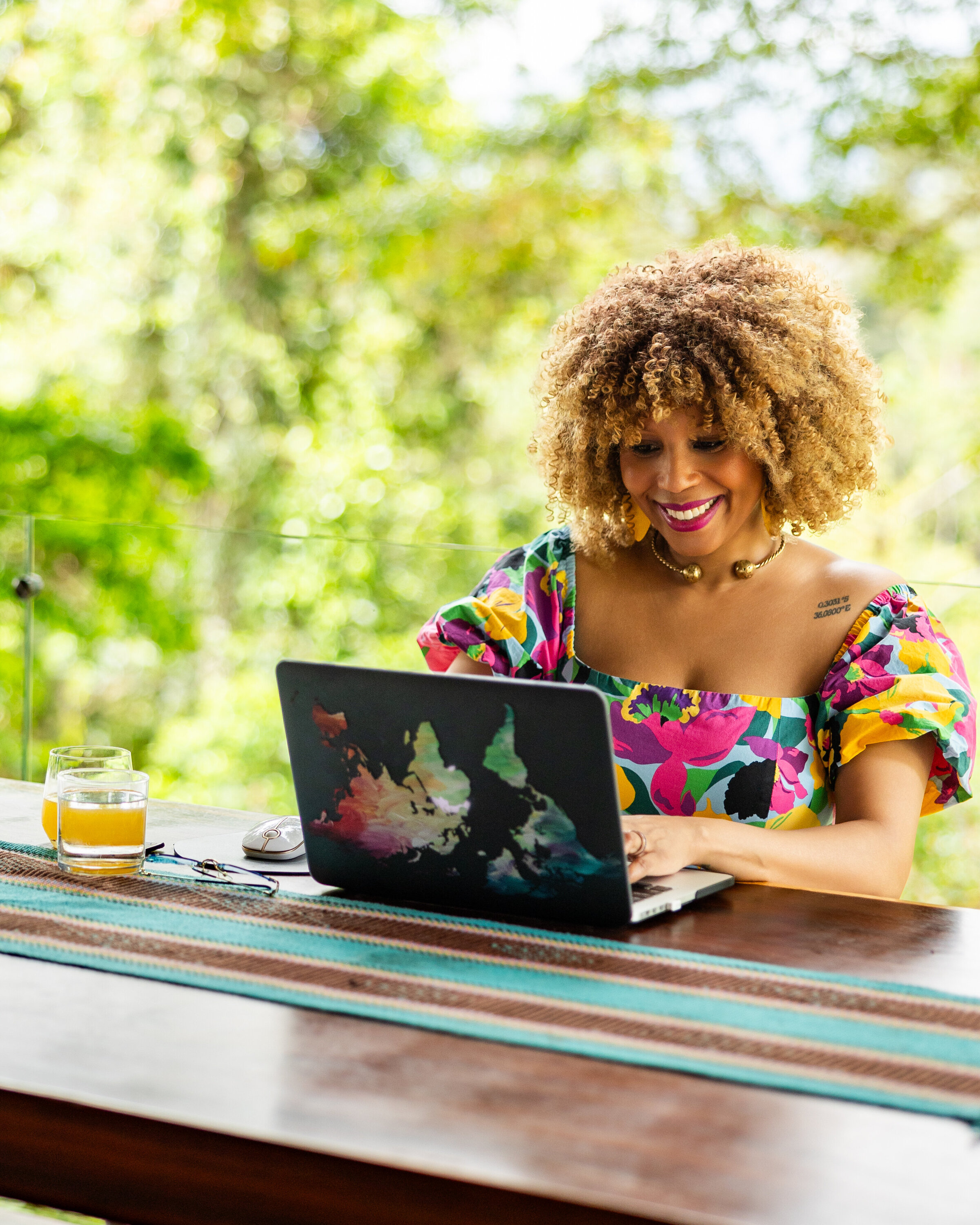 professional woman at her laptop in the tropics