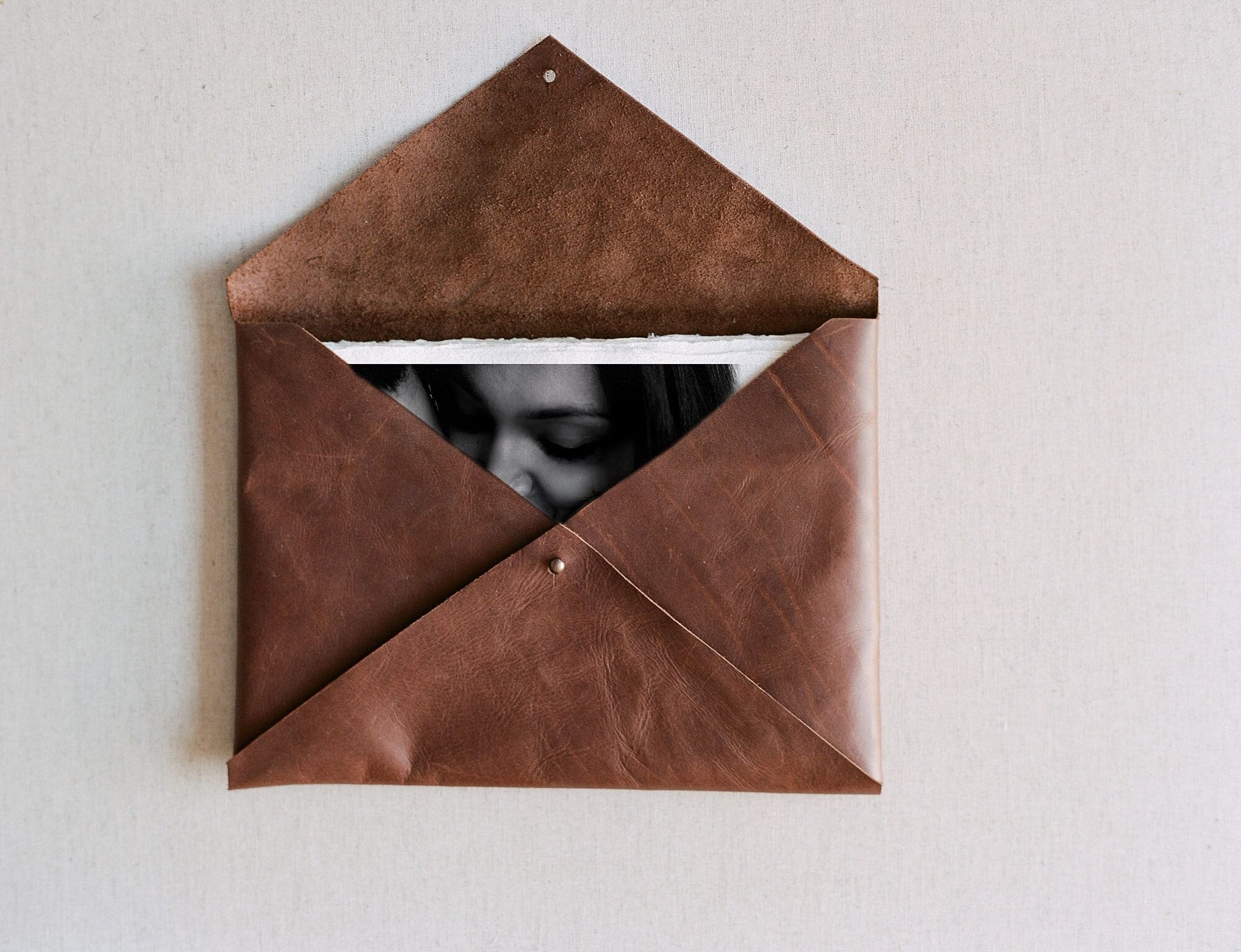 leather envelope with printed iamgess from a photography perth lifestyle session - gracie and the wren photographer