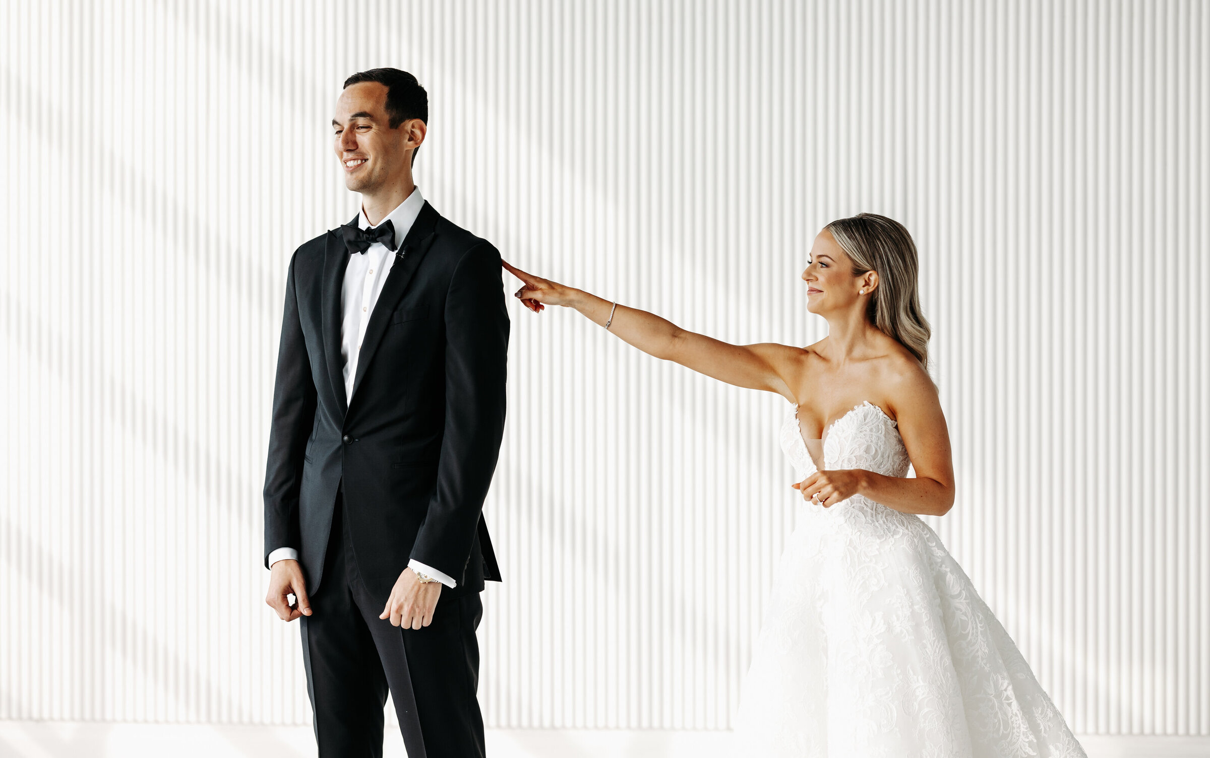 Bride taps groom on shoulder for first look in New York City, New York