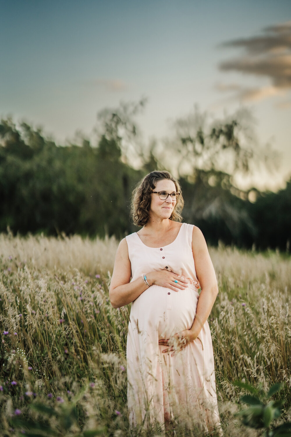 pregnant mom in pink dress takes august boston maternity photos
