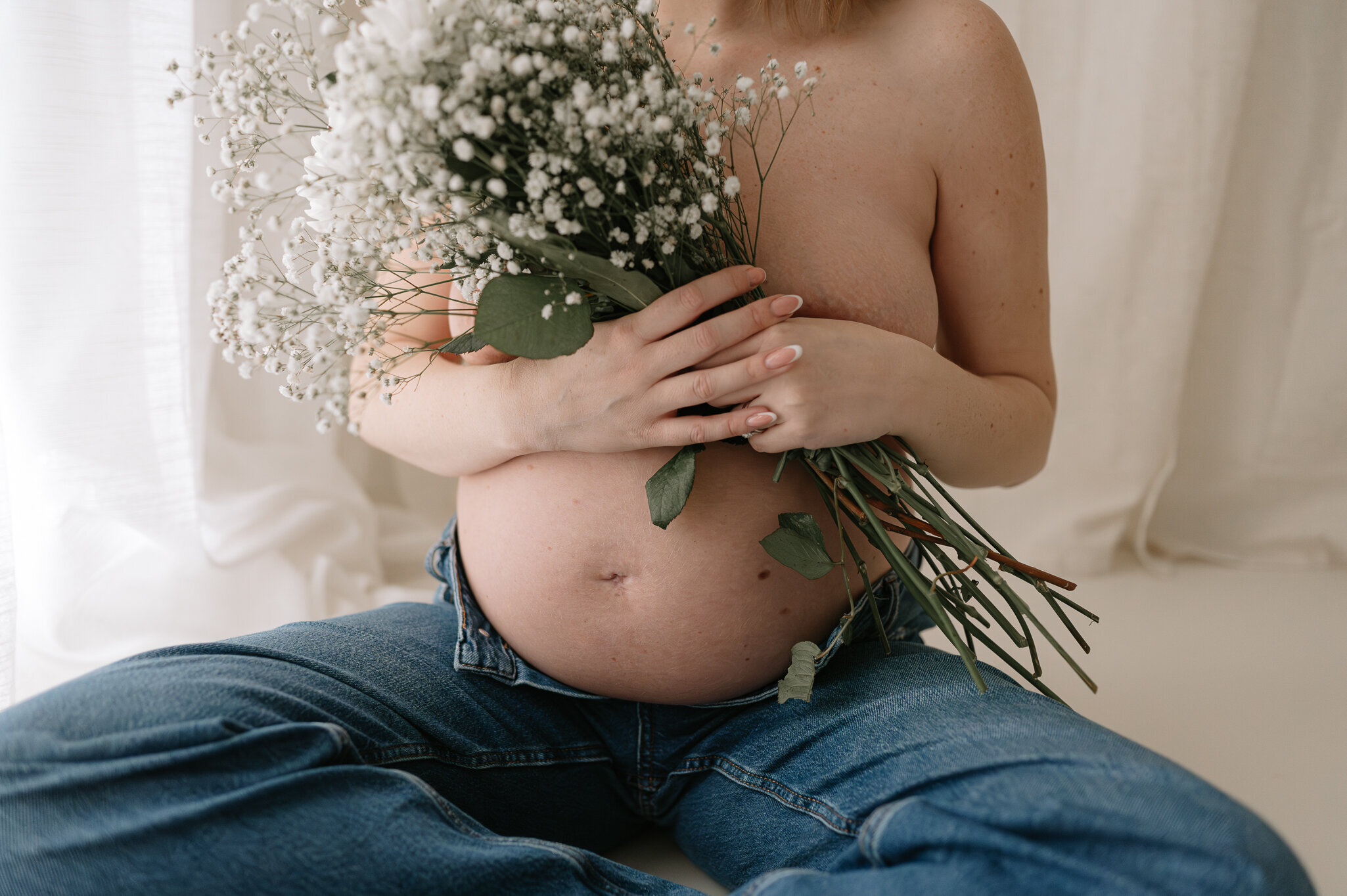york Mum who is pregnant holding beautiful flowers