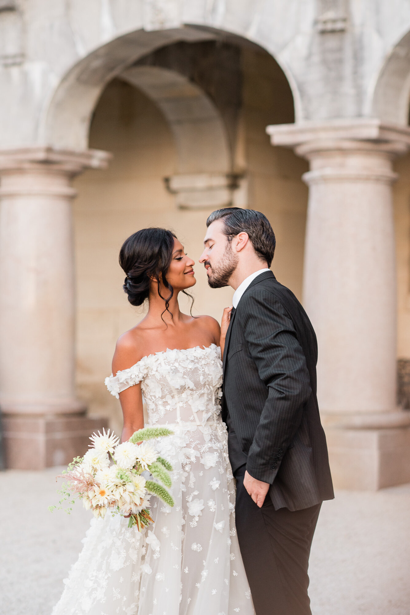 indian bride white groom looking each other almost kissing