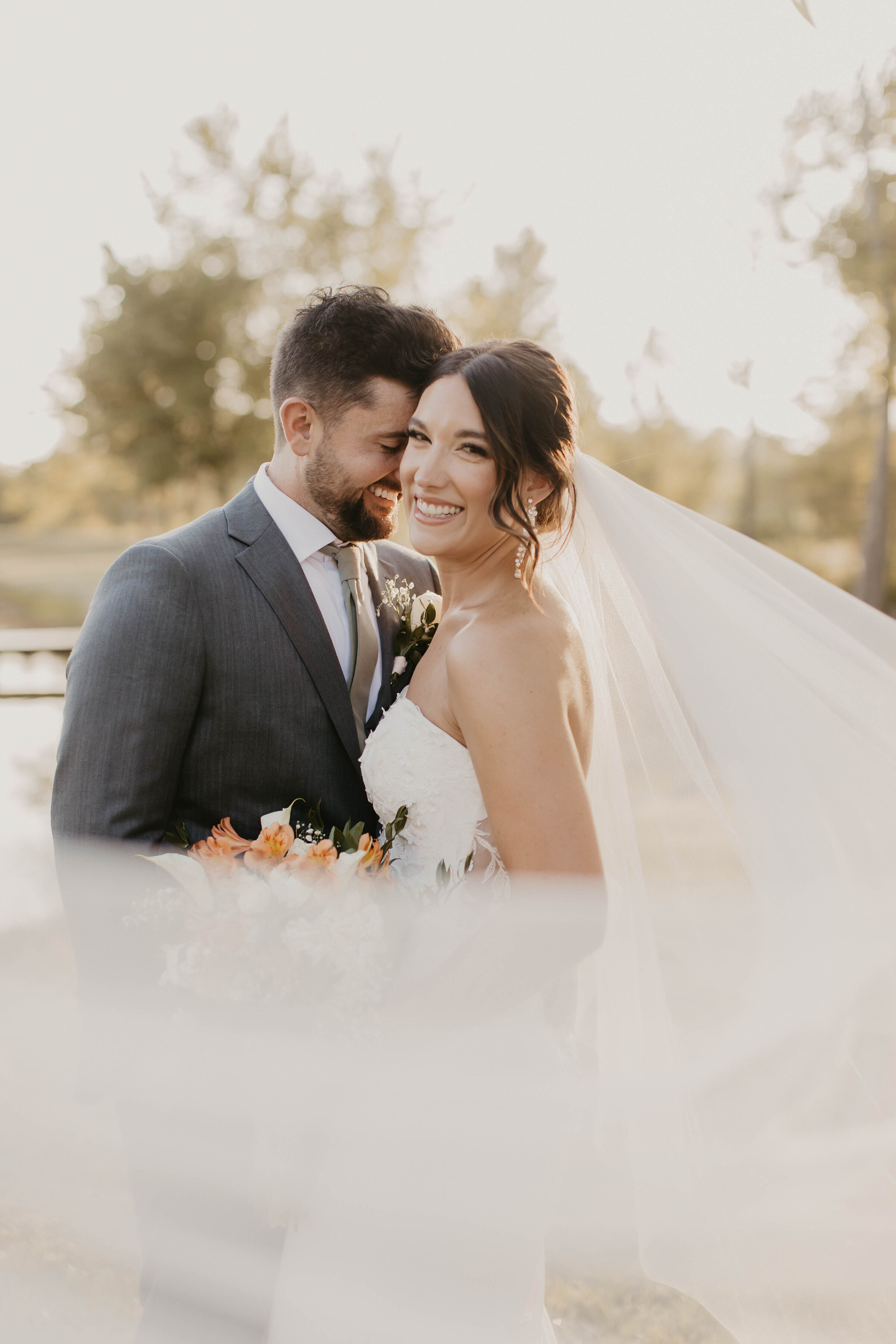 Bride and groom in close embrace. 