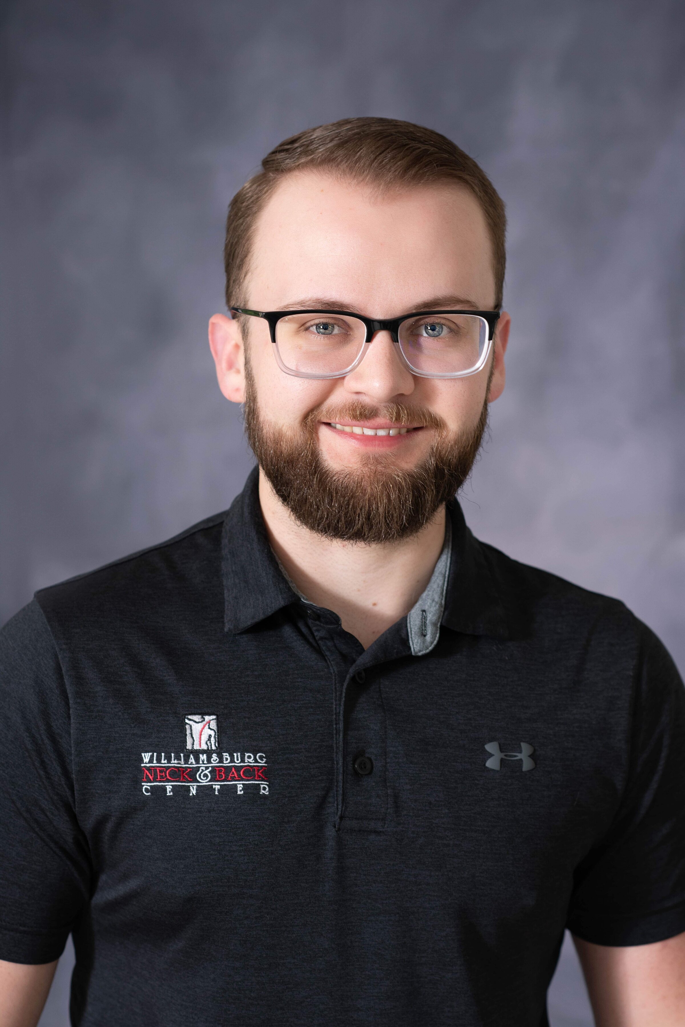 Executive headshot in Virginia with studio backdrop for company website