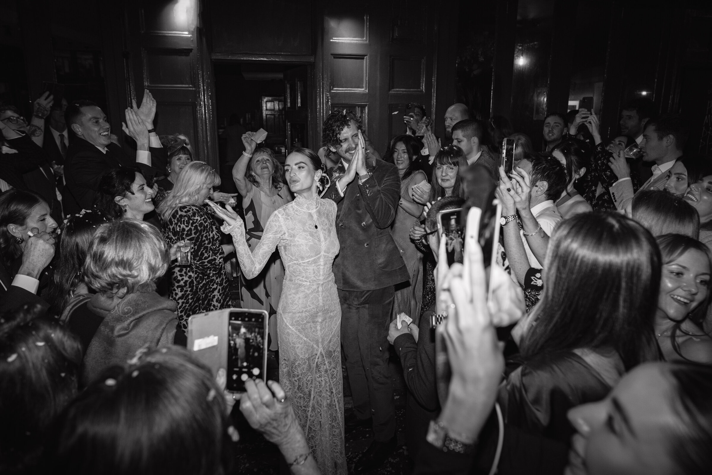 Close angle view of an embrace at a garden wedding ceremony in the Cotswolds