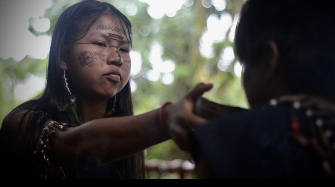 Kichwa girl serving guayusa