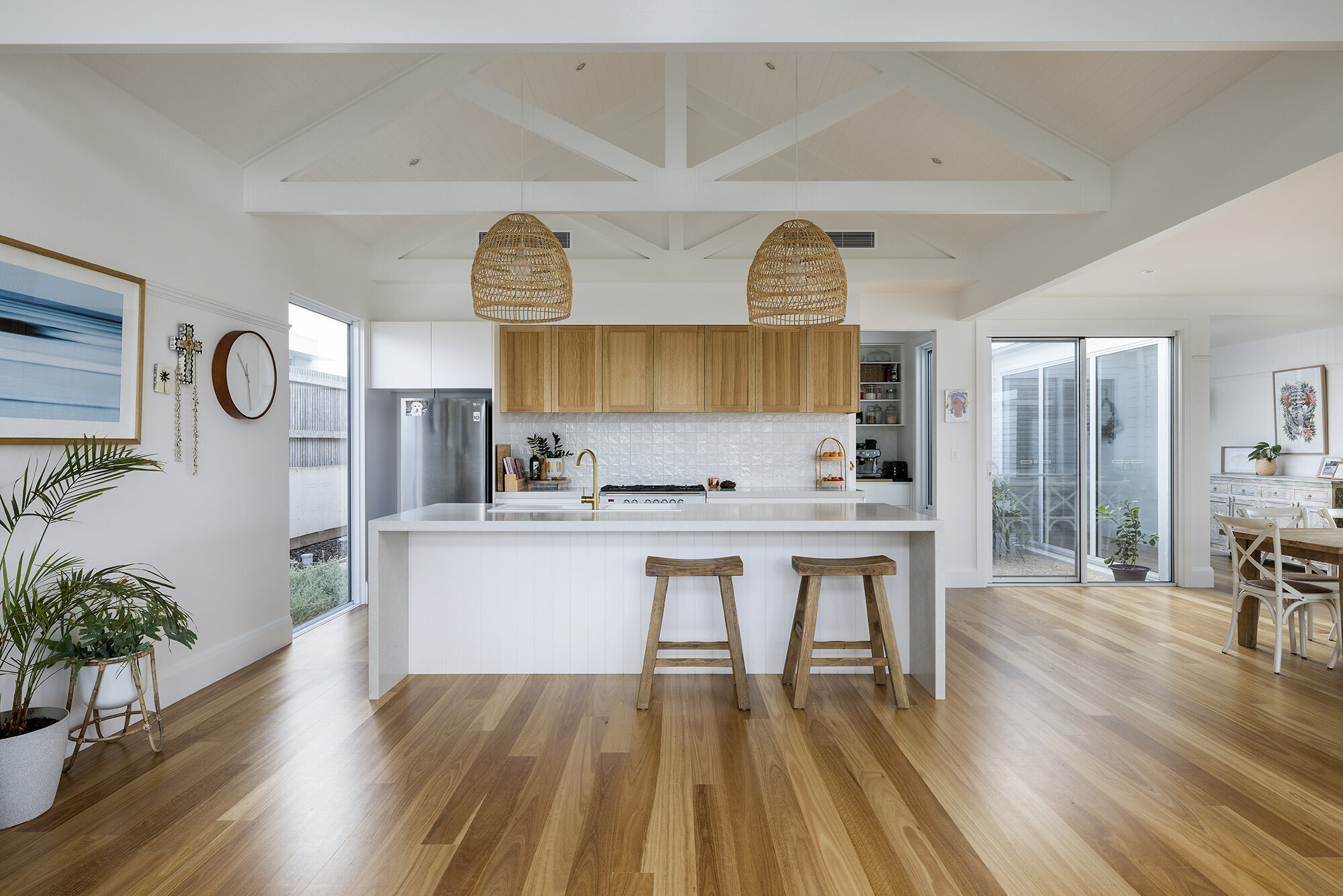 White and timber kitchen pitched ceiling exposed beams