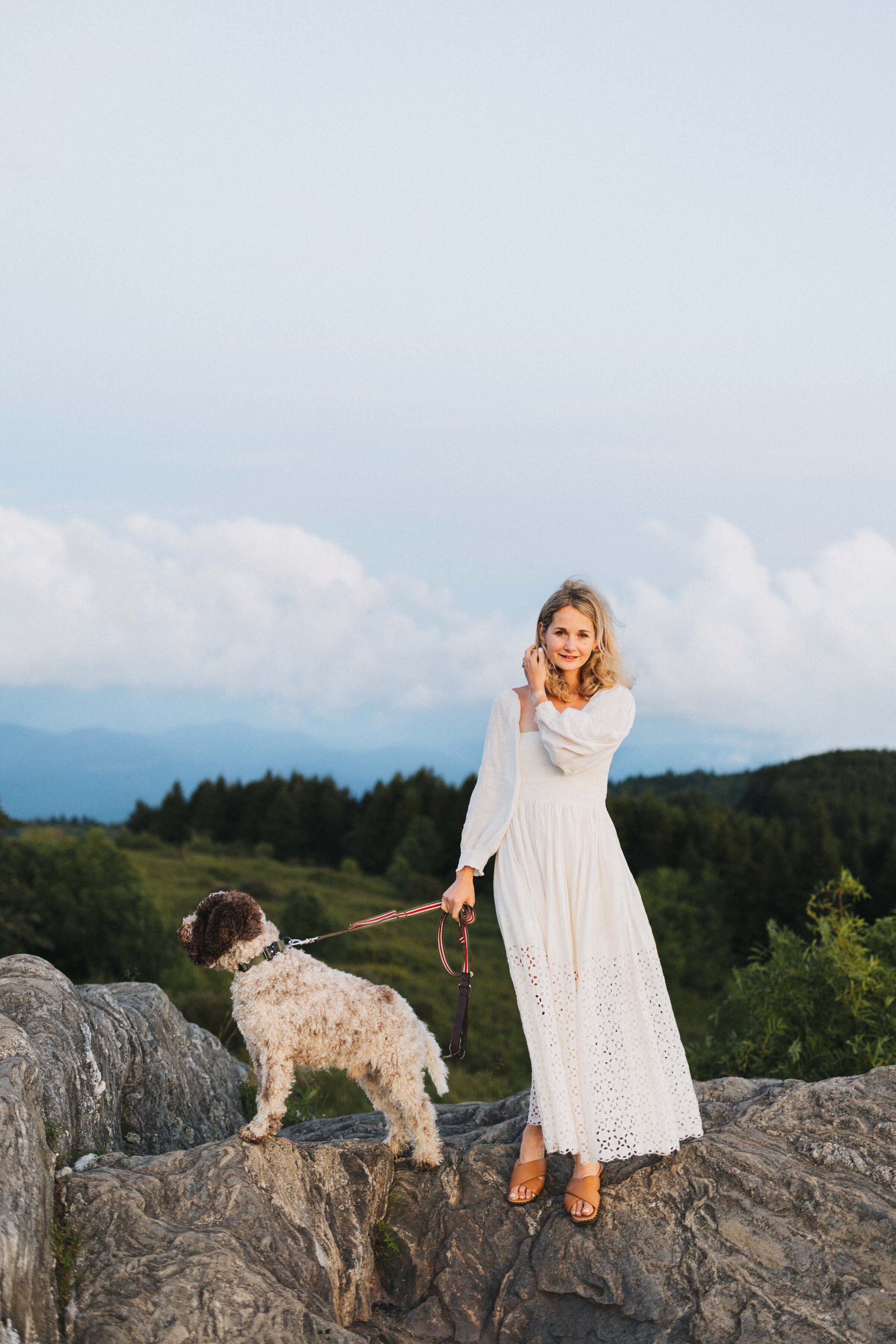 girl with her dog at the mountains