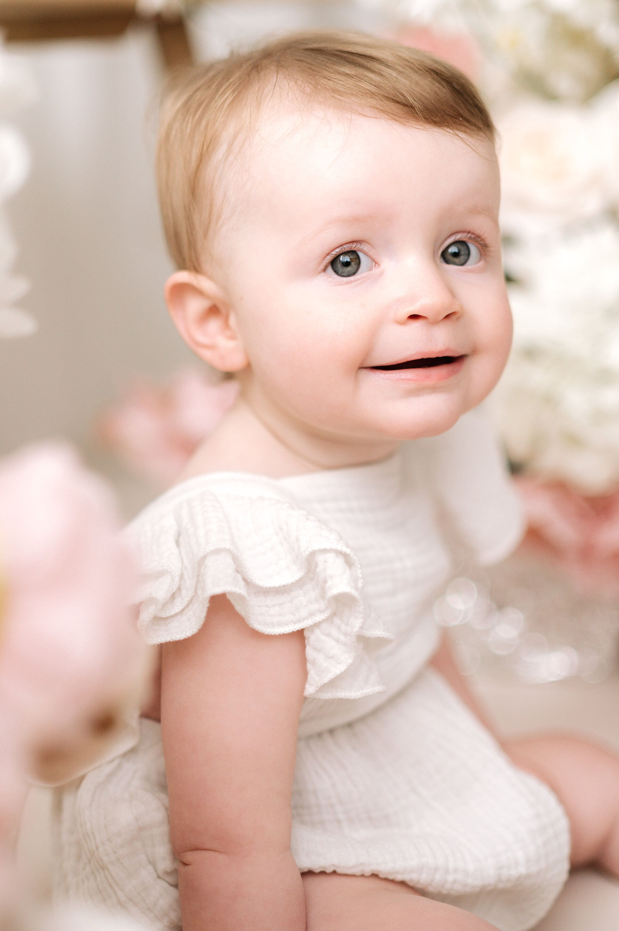A one year old girl smiling at Horsham family photoshoot