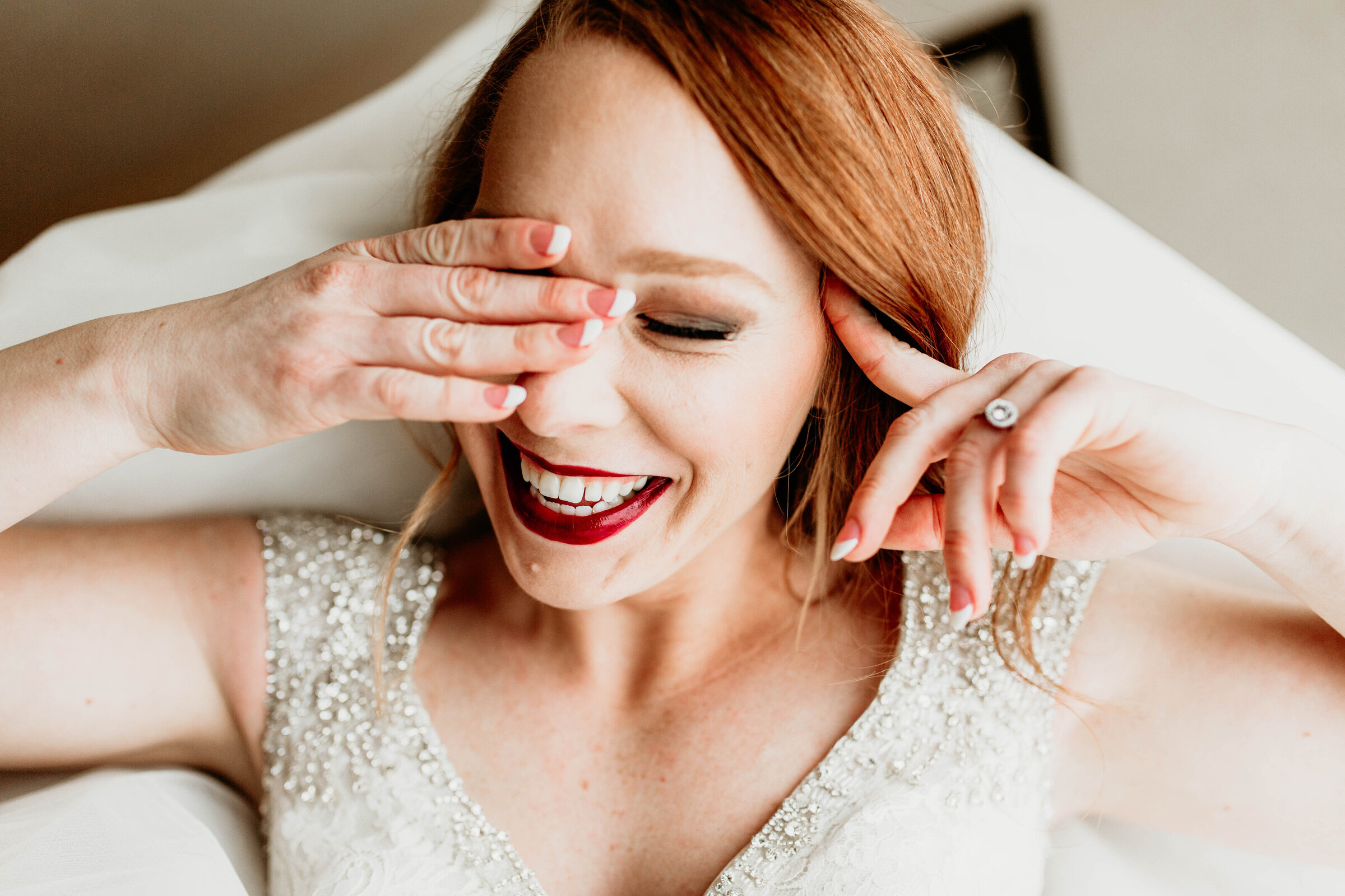 Bride very excited after putting on her wedding gown. 