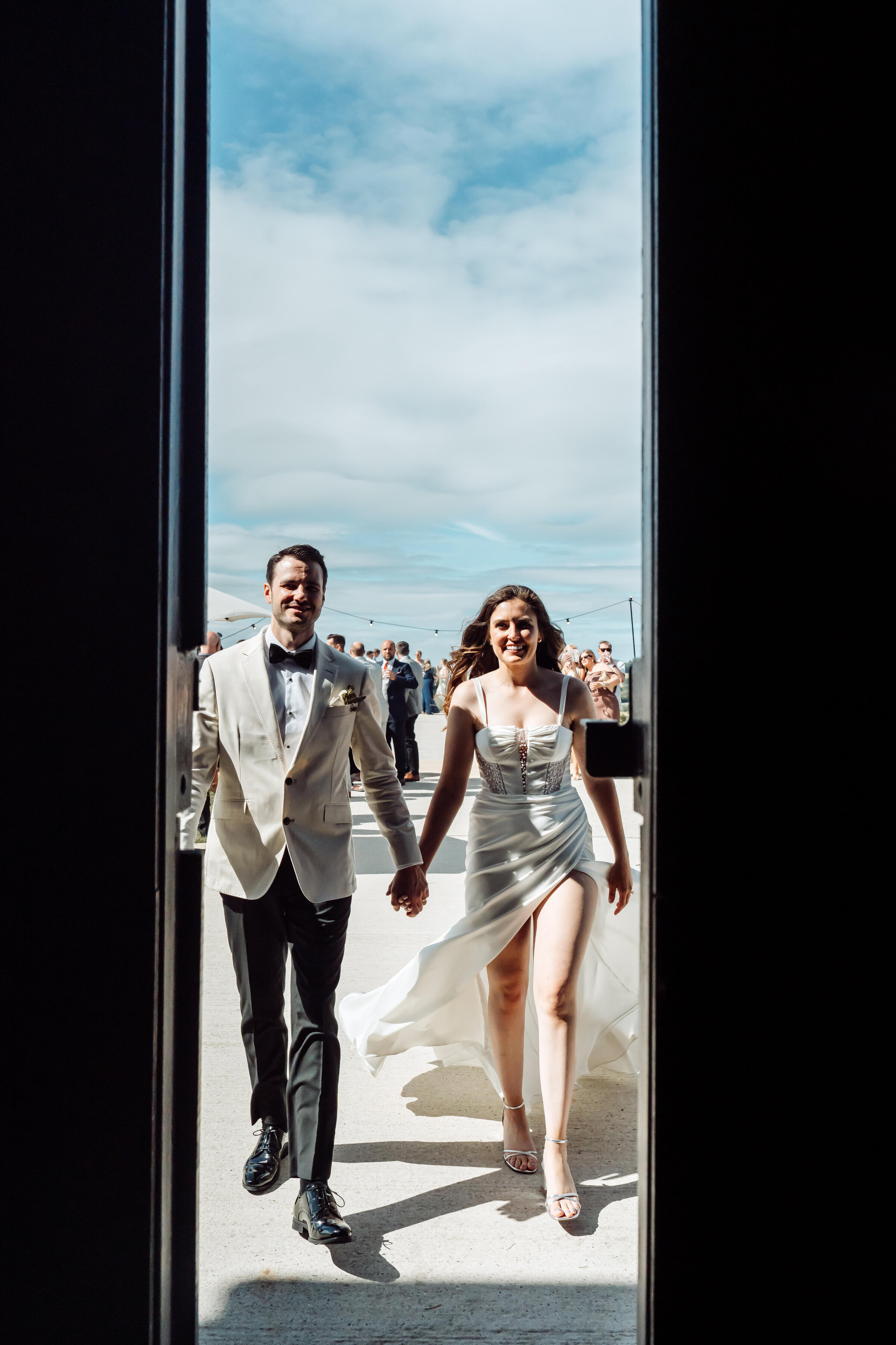 wedding-couple-walking-barn-sussex