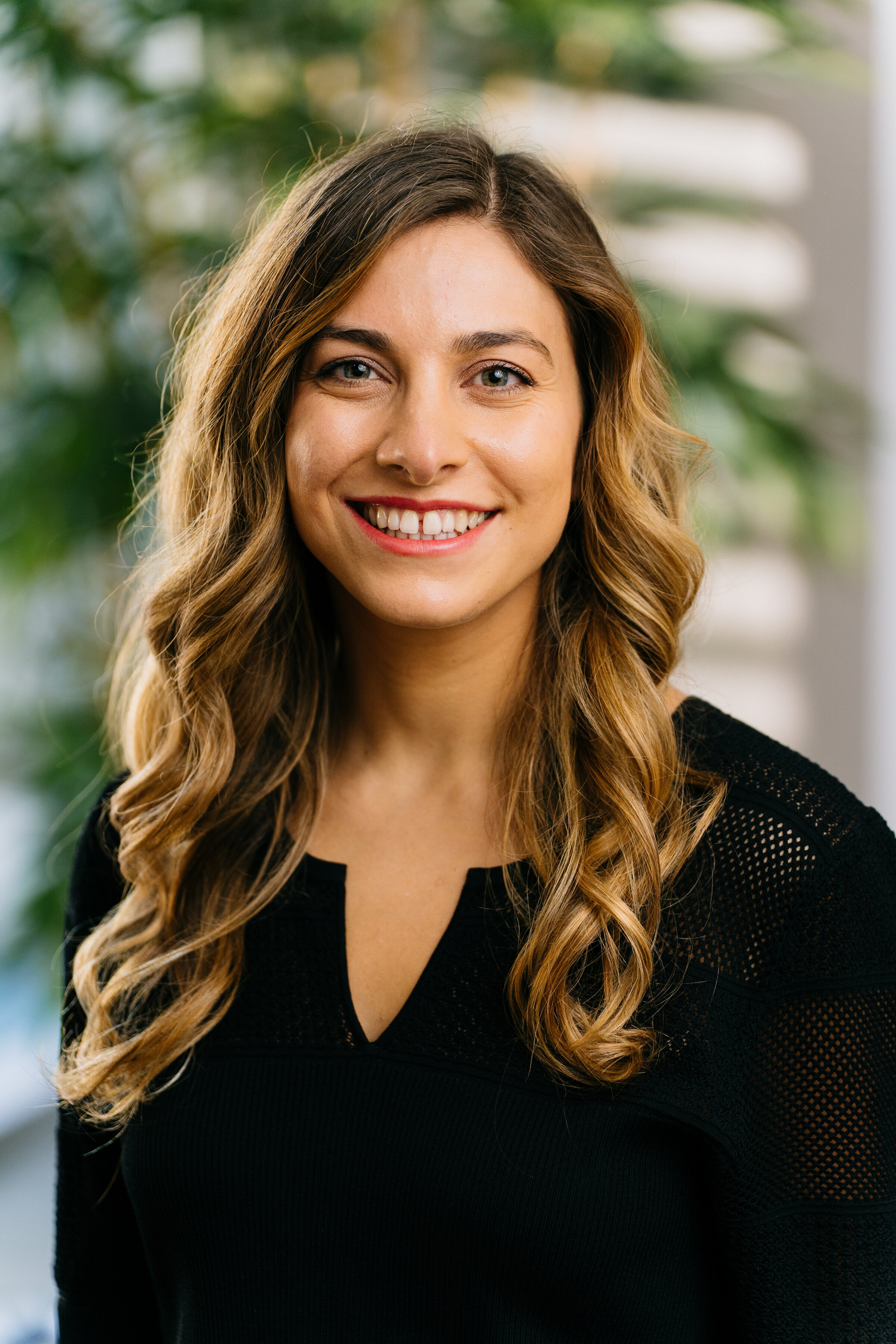 Corporate headshot with natural light backdrop