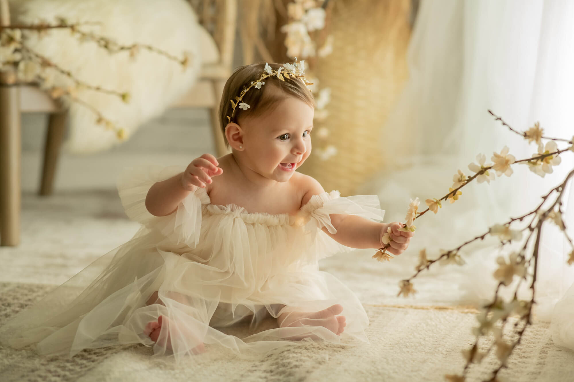 7 month old girl with flowers and tulle dress