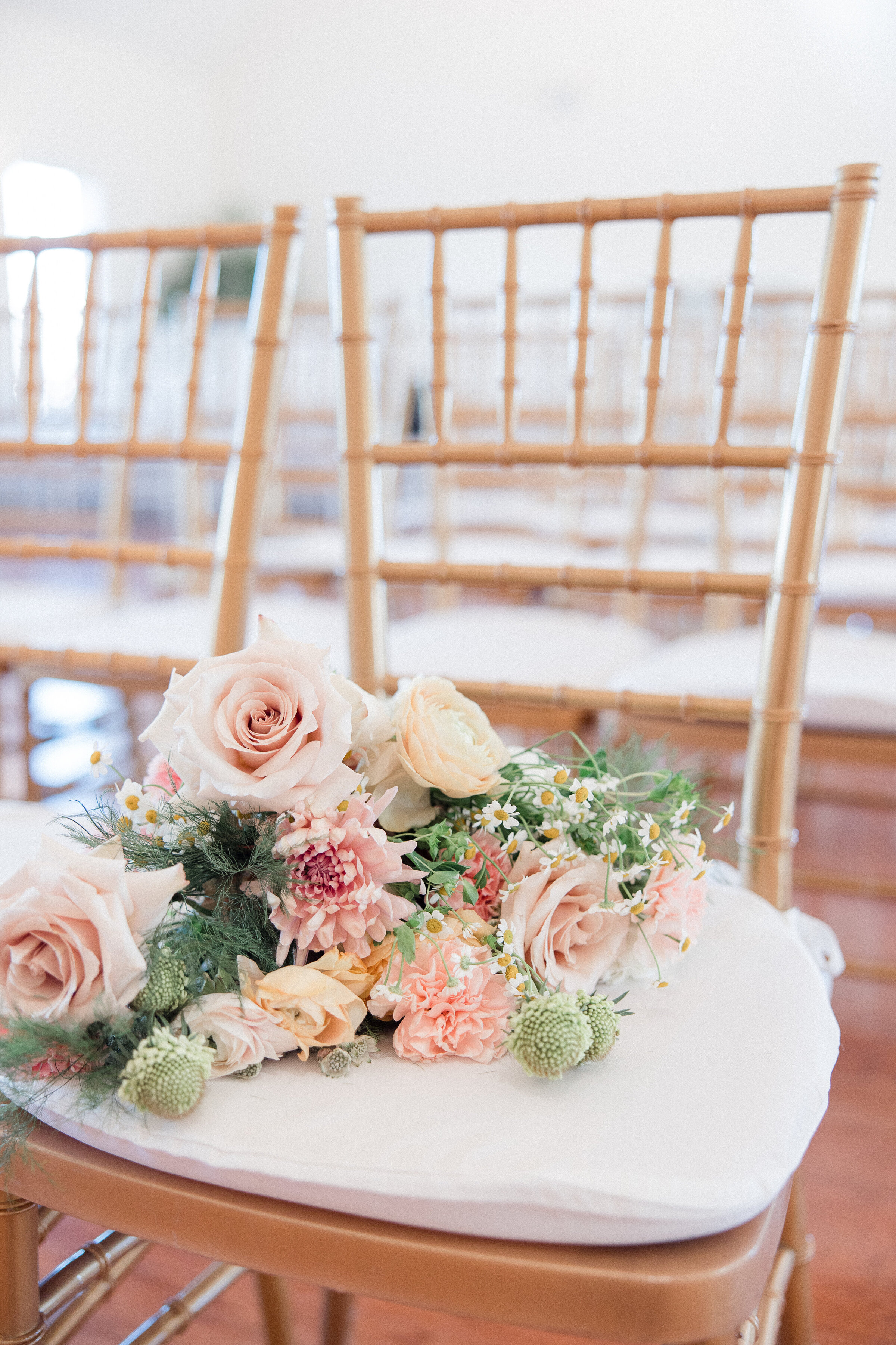 bridal bouquet sitting in ceremony chair