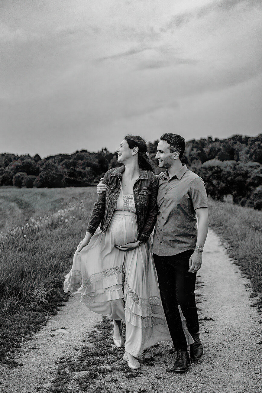 black and white maternity portrait on dirt road