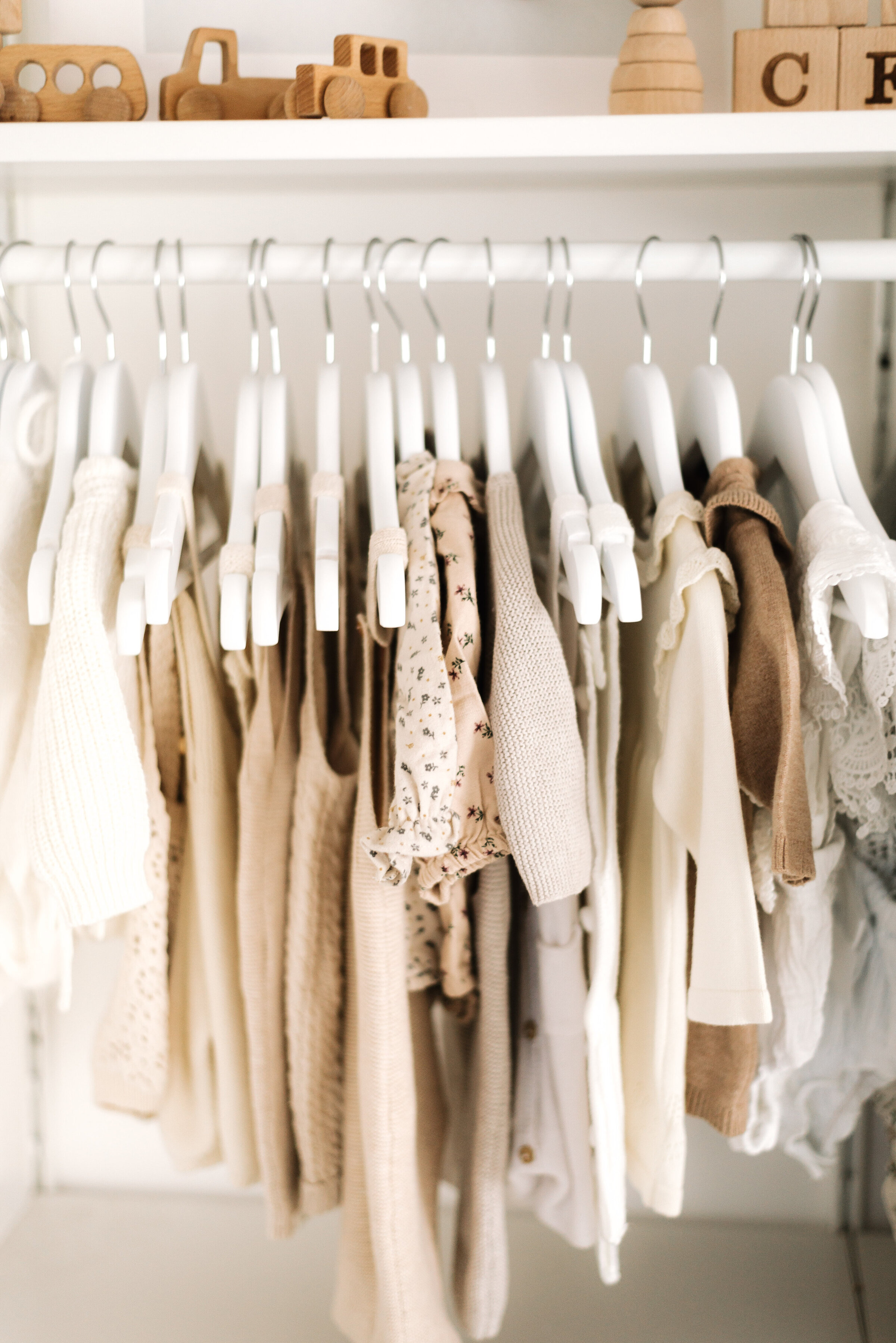 Baby clothes Paige Anderson Photography provides in cake smash studio in Billingshurst