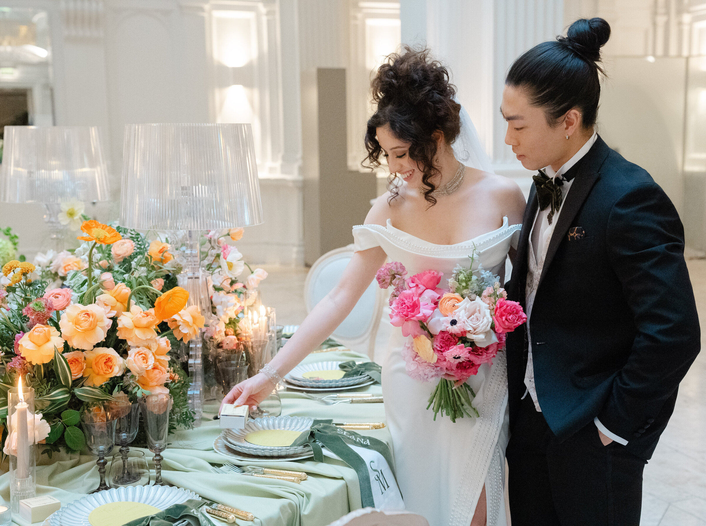 Bride and groom admire their wedding table setup at Andaz Hotel in London, captured by Chi Ramos Photography — multicultural wedding specialist.