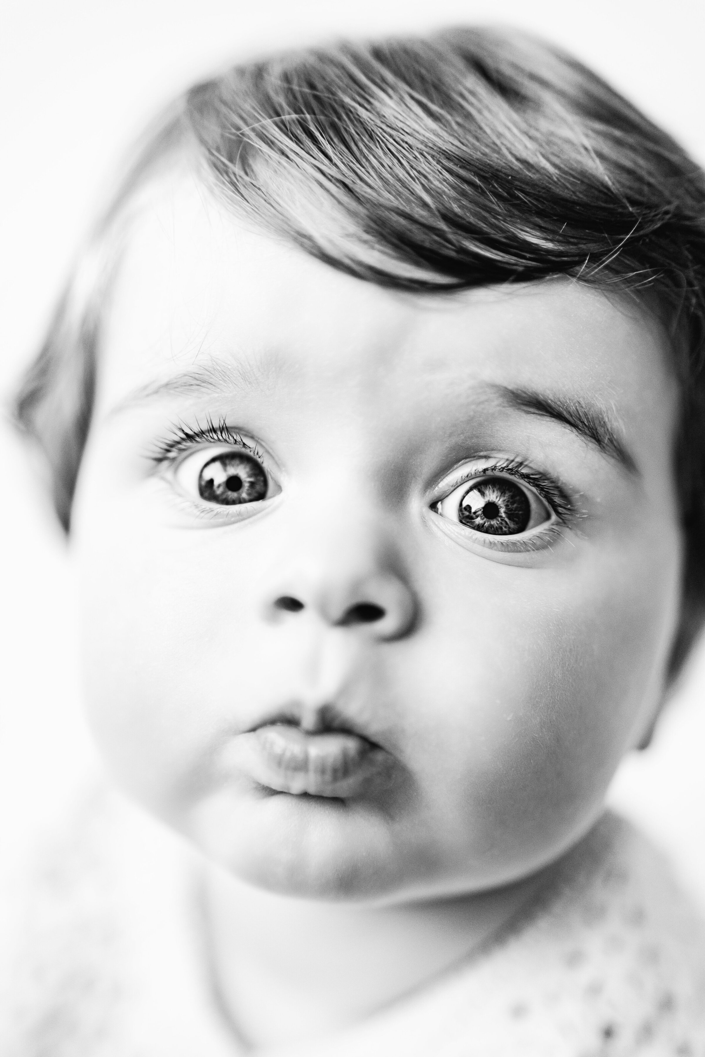 Little boy pouting at milestone photoshoot in Billingshurst